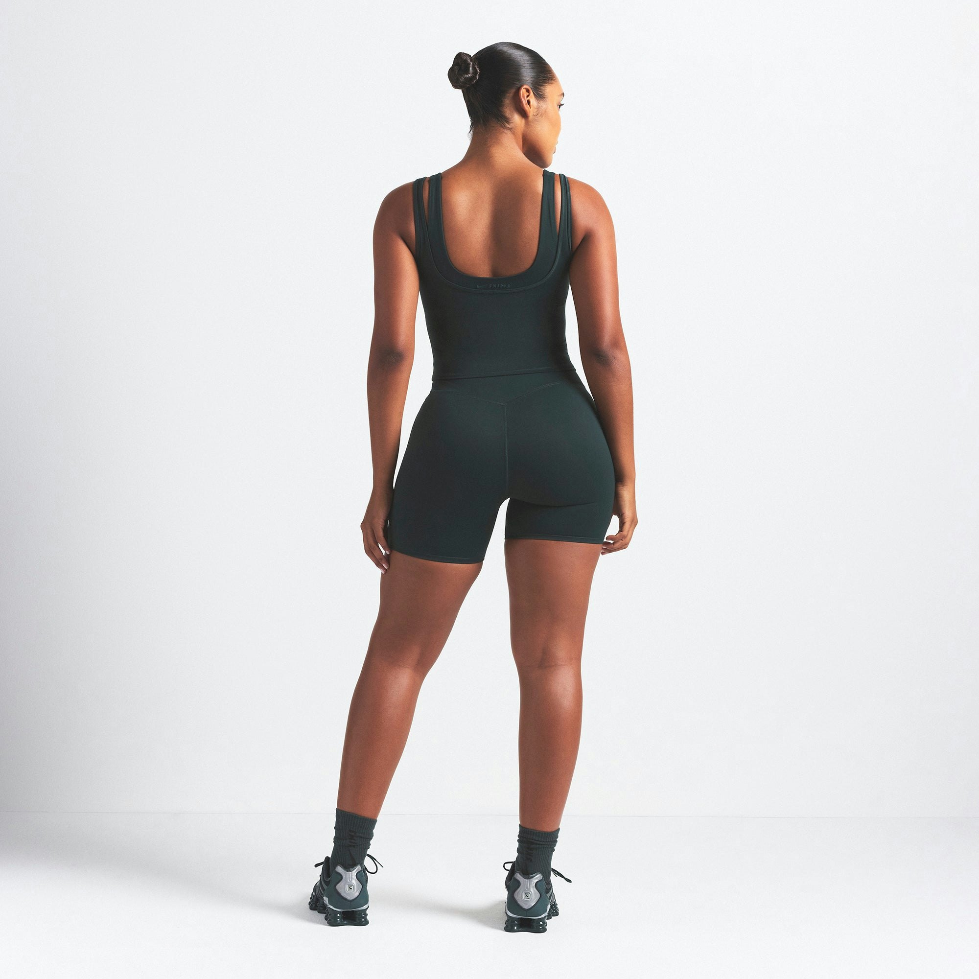 NikeSKIMS MATTE DOUBLE STRAP SCOOP TANK | DARK TEAL ON A MODEL SIDE VIEW @ | FOCUS: 0.0, 1.0, 0.9