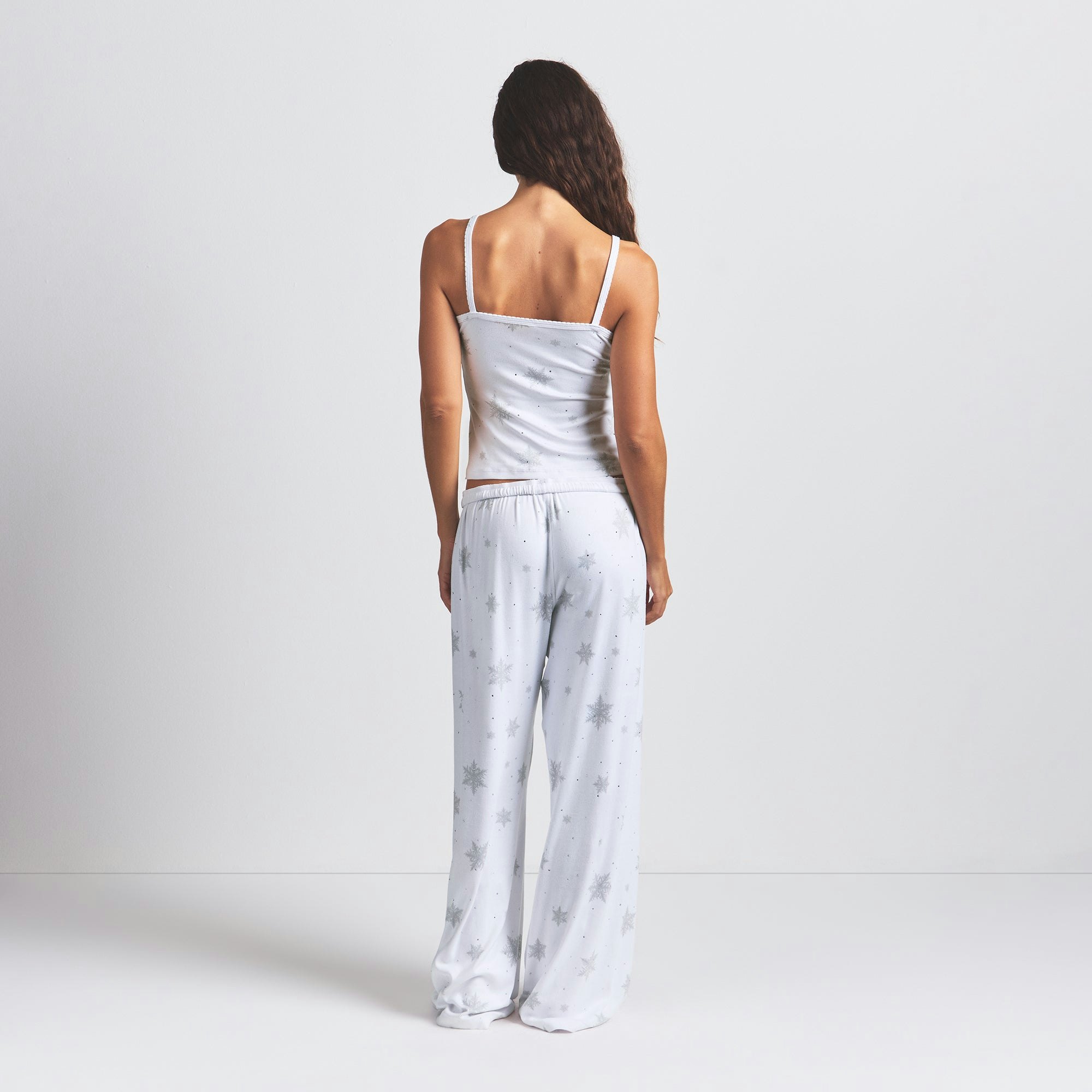 LOGO PLUSH POINTELLE RHINESTONE TANK | SNOW RHINESTONE PRINT ON A MODEL BACK VIEW @ | FOCUS: 0.0, 1.0, 0.9