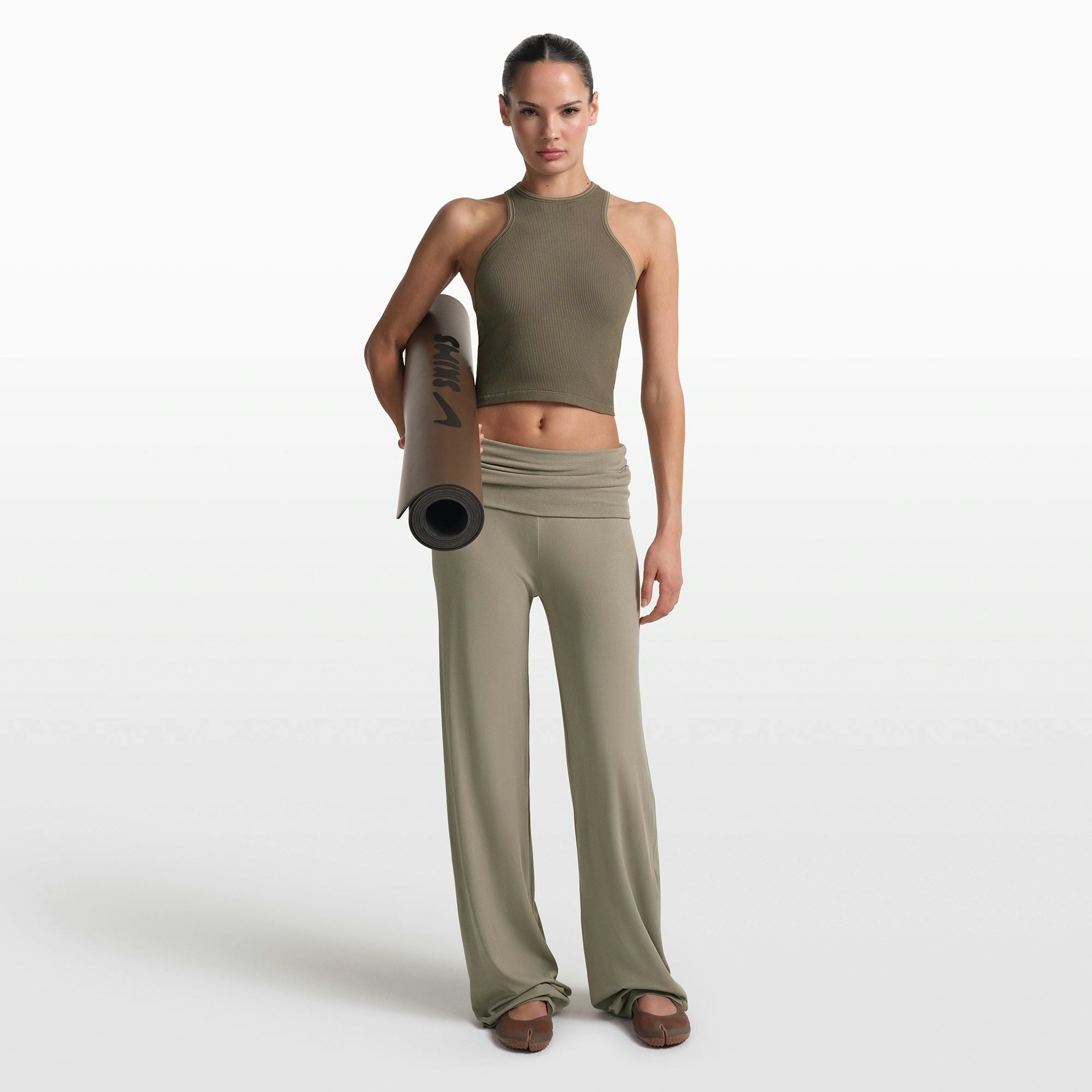 NikeSKIMS RIBBED SEAMLESS RACER FRONT TANK | DUSTY OAKMOSS/DUNE ON A MODEL FRONT VIEW @ | FOCUS: 0.0, 1.0, 0.9