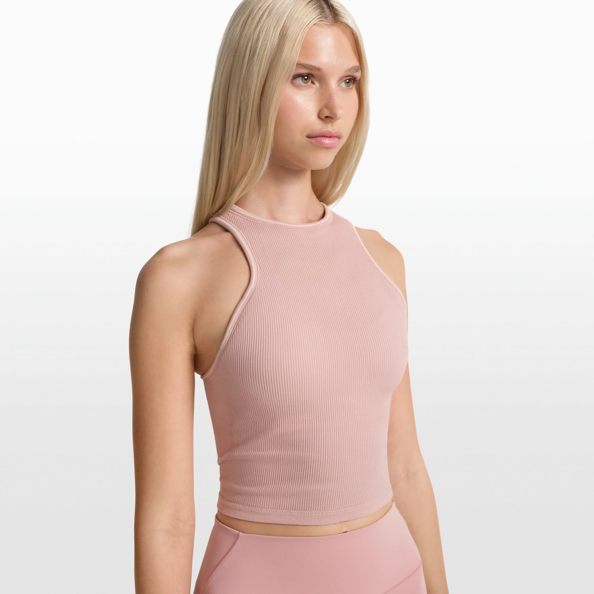NikeSKIMS RIBBED SEAMLESS RACER FRONT TANK | HIMALAYAN ON A MODEL FRONT VIEW @ | FOCUS: 0.0, 1.0, 0.9
