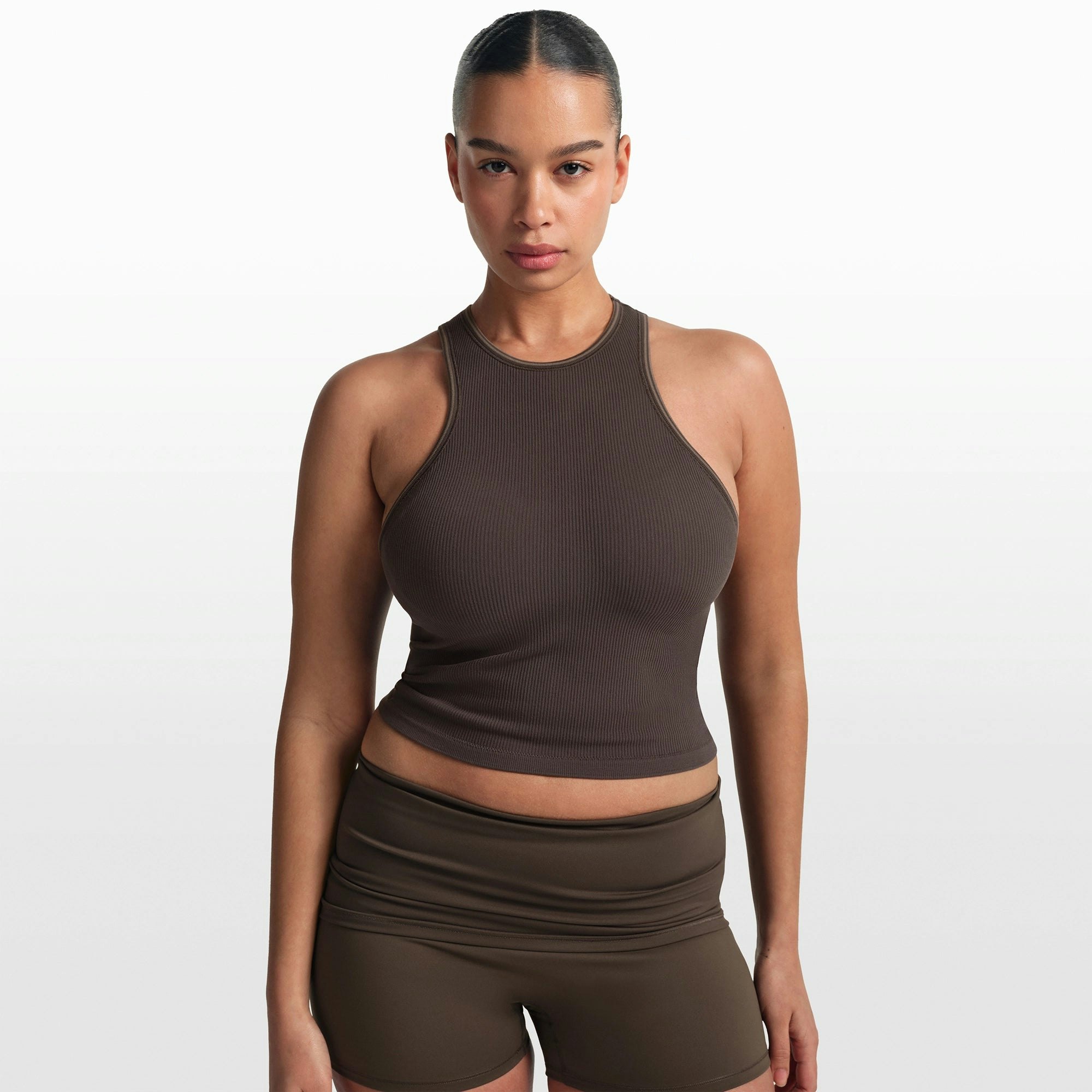 NikeSKIMS RIBBED SEAMLESS RACER FRONT TANK | PHOENIX/TRUFFLE ON A MODEL FRONT VIEW @ | FOCUS: 0.0, 1.0, 0.9