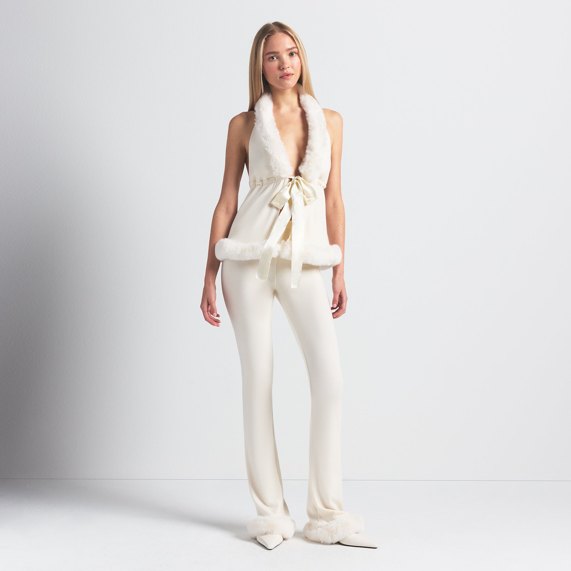 SKIMS CLOUD HALTER TOP | ECRU ON A MODEL FRONT VIEW @ | FOCUS: 0.0, 1.0, 0.9