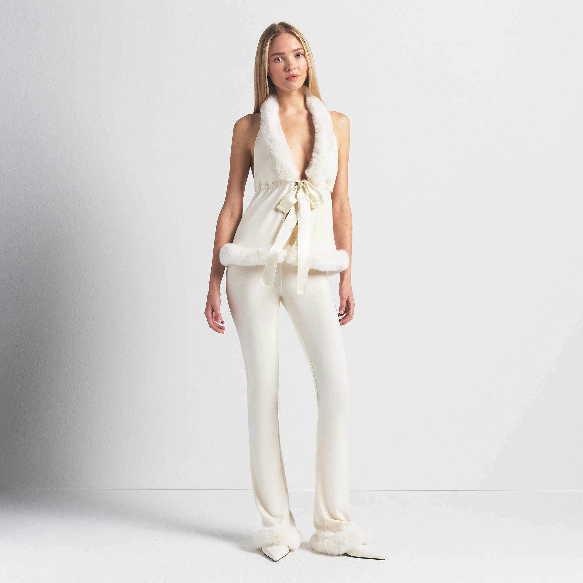 SKIMS CLOUD HALTER TOP | ECRU ON A MODEL FRONT VIEW @ | FOCUS: 0.0, 1.0, 0.9