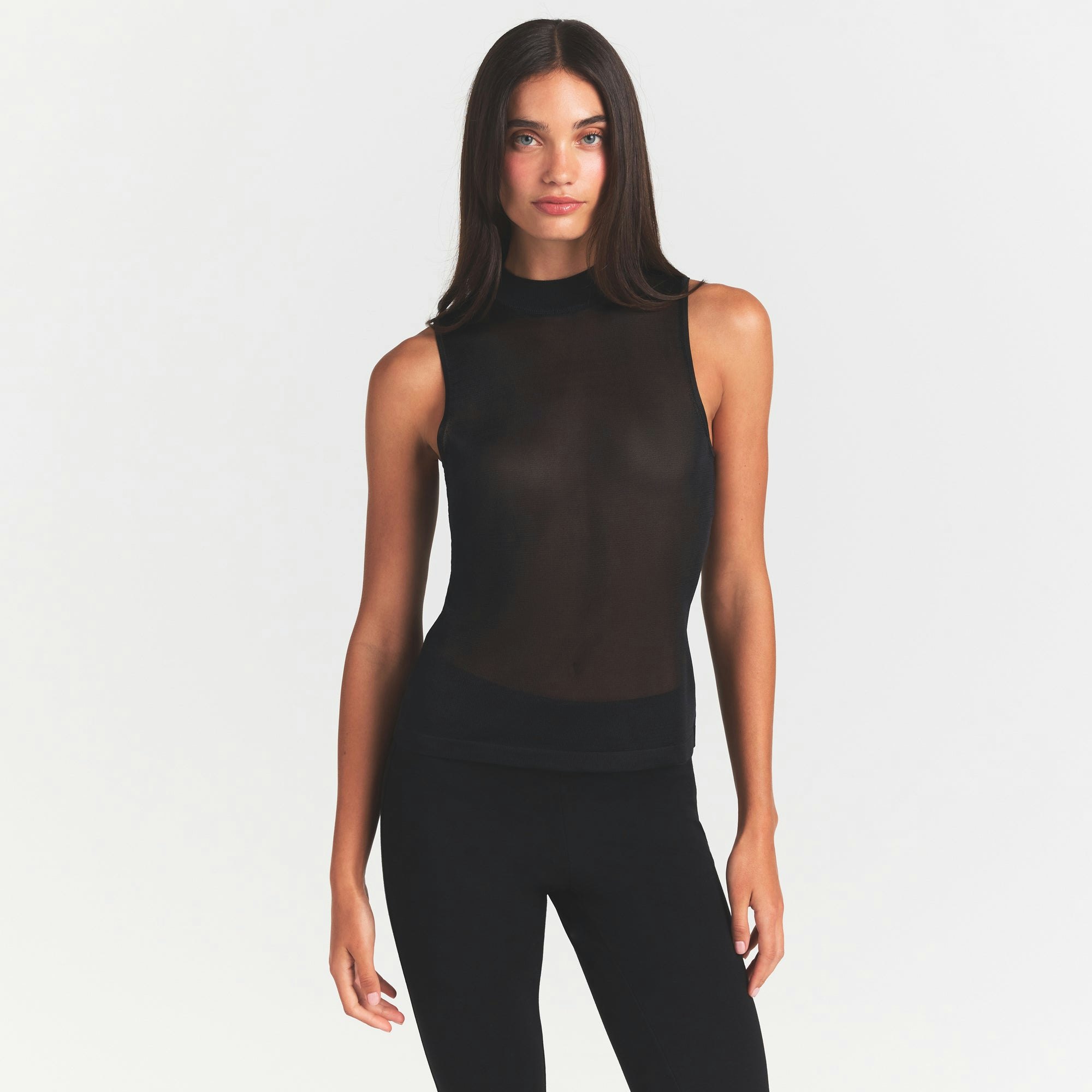 SLINKY KNIT MOCK NECK TANK | OBSIDIAN ON A MODEL SIDE VIEW @ | FOCUS: 0.0, 1.0, 0.9