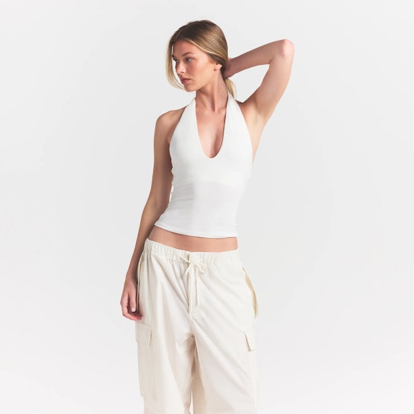 SMOOTH LAYERS HALTER TOP | EGRET ON A MODEL FRONT VIEW