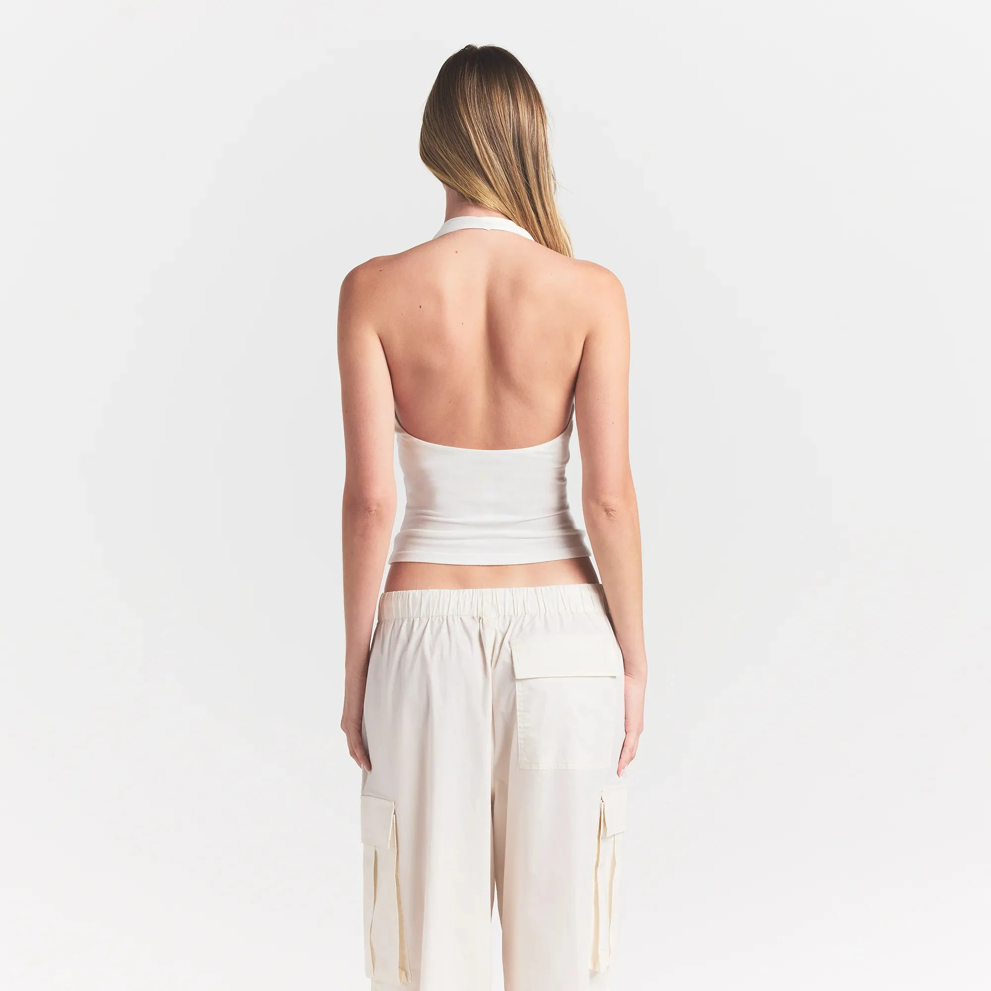 SMOOTH LAYERS HALTER TOP | EGRET ON A MODEL BACK VIEW @ | FOCUS: 0.0, 1.0, 0.9