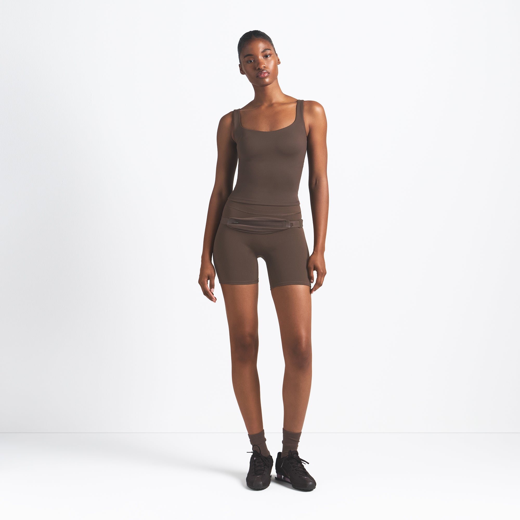 NikeSKIMS MATTE SQUARE NECK TANK | DARK SEPIA ON A MODEL FRONT VIEW @ | FOCUS: 0.9, 0.1, 0.7