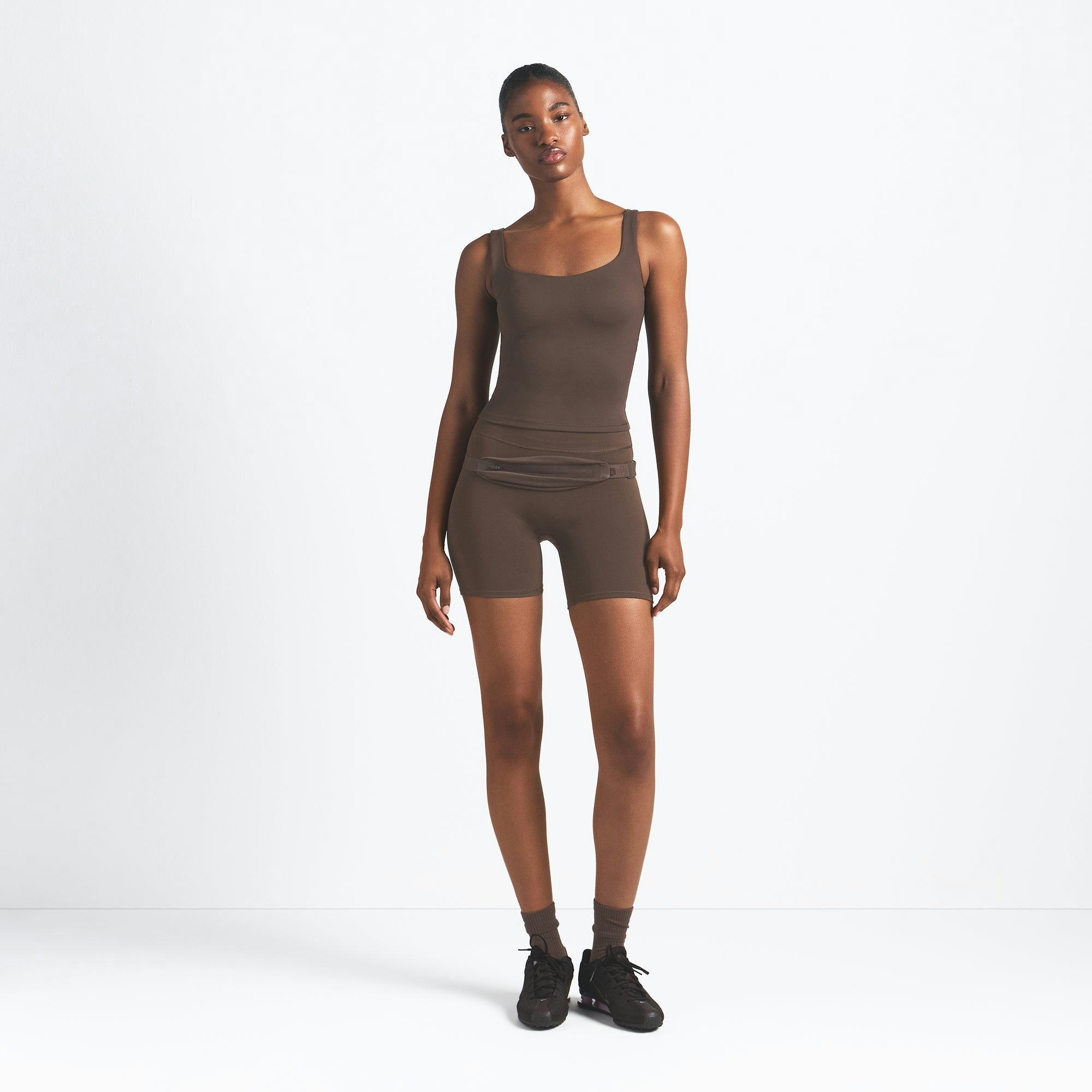 NikeSKIMS MATTE SQUARE NECK TANK | DARK SEPIA ON A MODEL FRONT VIEW @ | FOCUS: 0.9, 0.1, 0.7