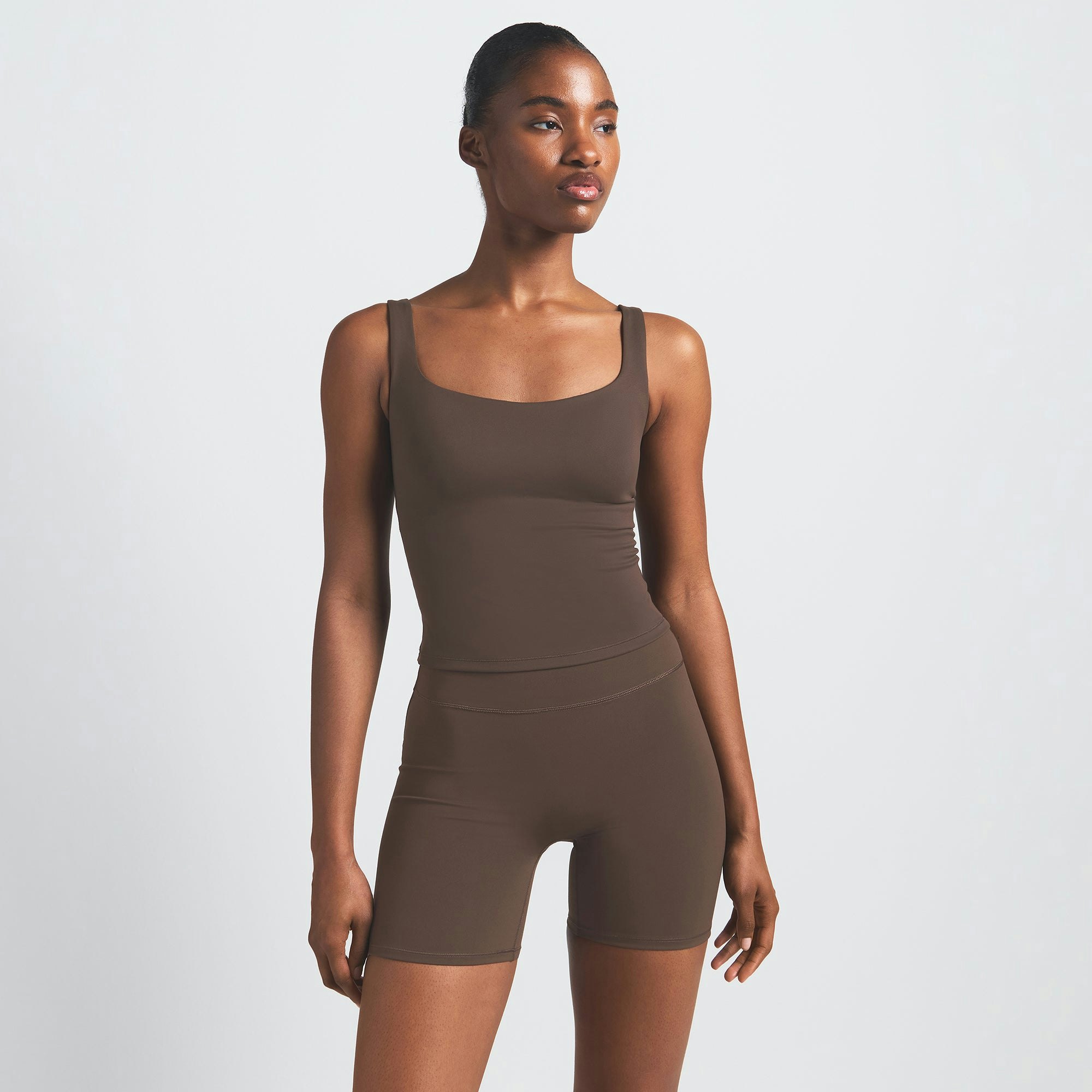 NikeSKIMS MATTE SQUARE NECK TANK | DARK SEPIA ON A MODEL FRONT VIEW