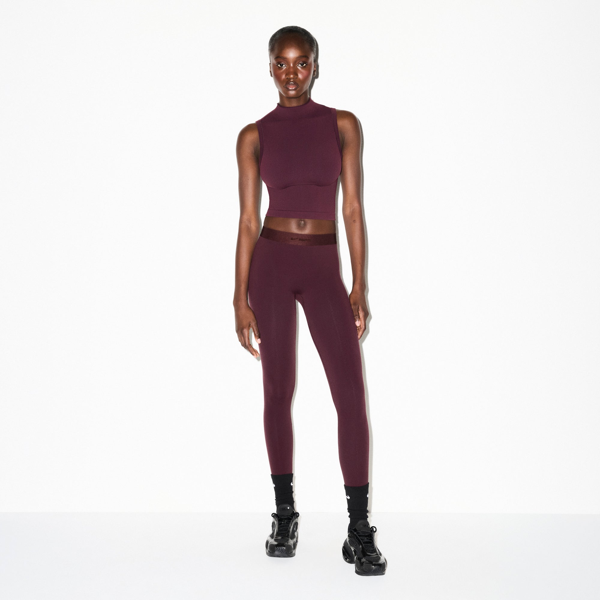 NikeSKIMS VINTAGE SEAMLESS MOCK NECK BRA TOP | CURRANT ON A MODEL FRONT VIEW @ | FOCUS: 0.0, 1.0, 0.9