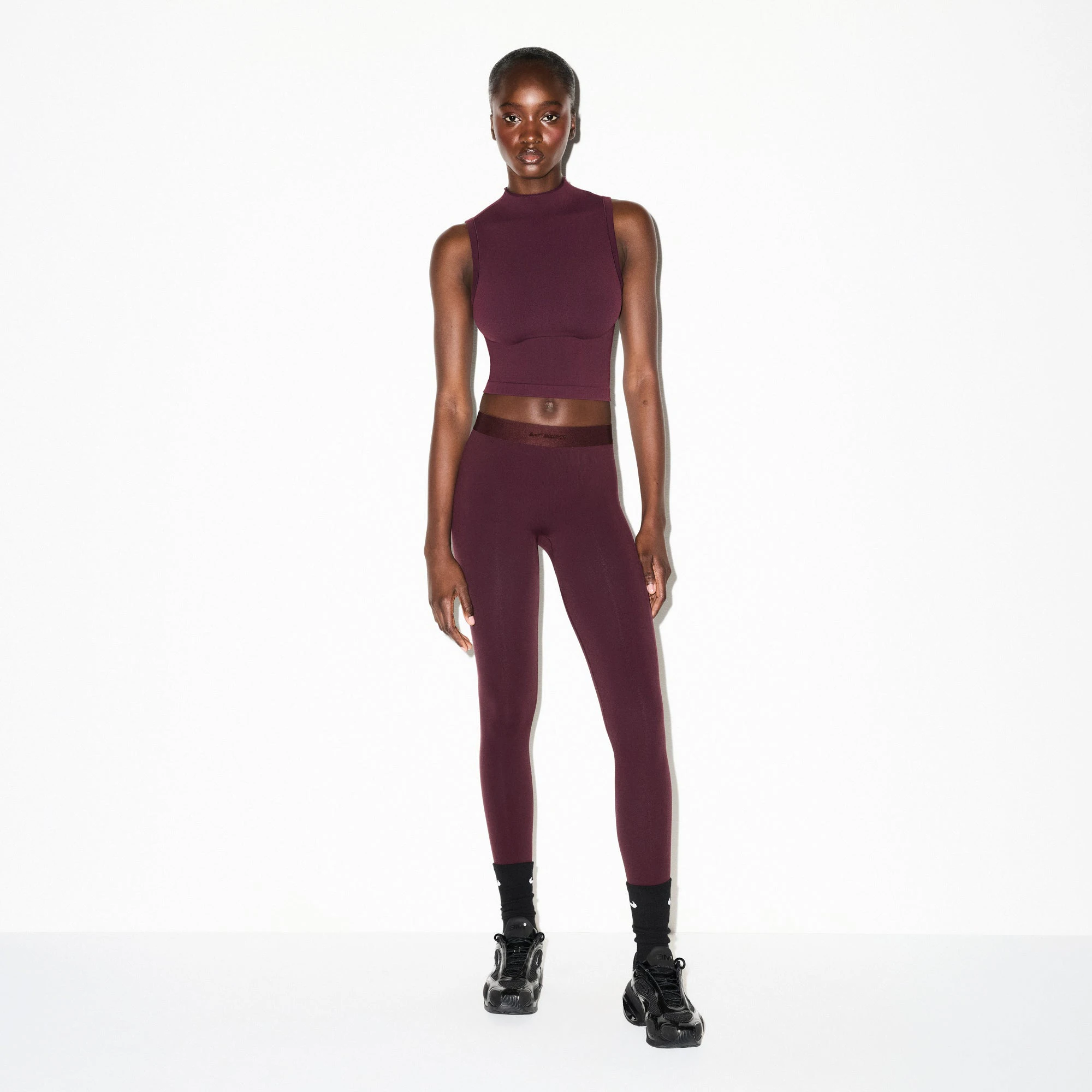 NikeSKIMS VINTAGE SEAMLESS MOCK NECK BRA TOP | CURRANT ON A MODEL FRONT VIEW @ | FOCUS: 0.0, 1.0, 0.9