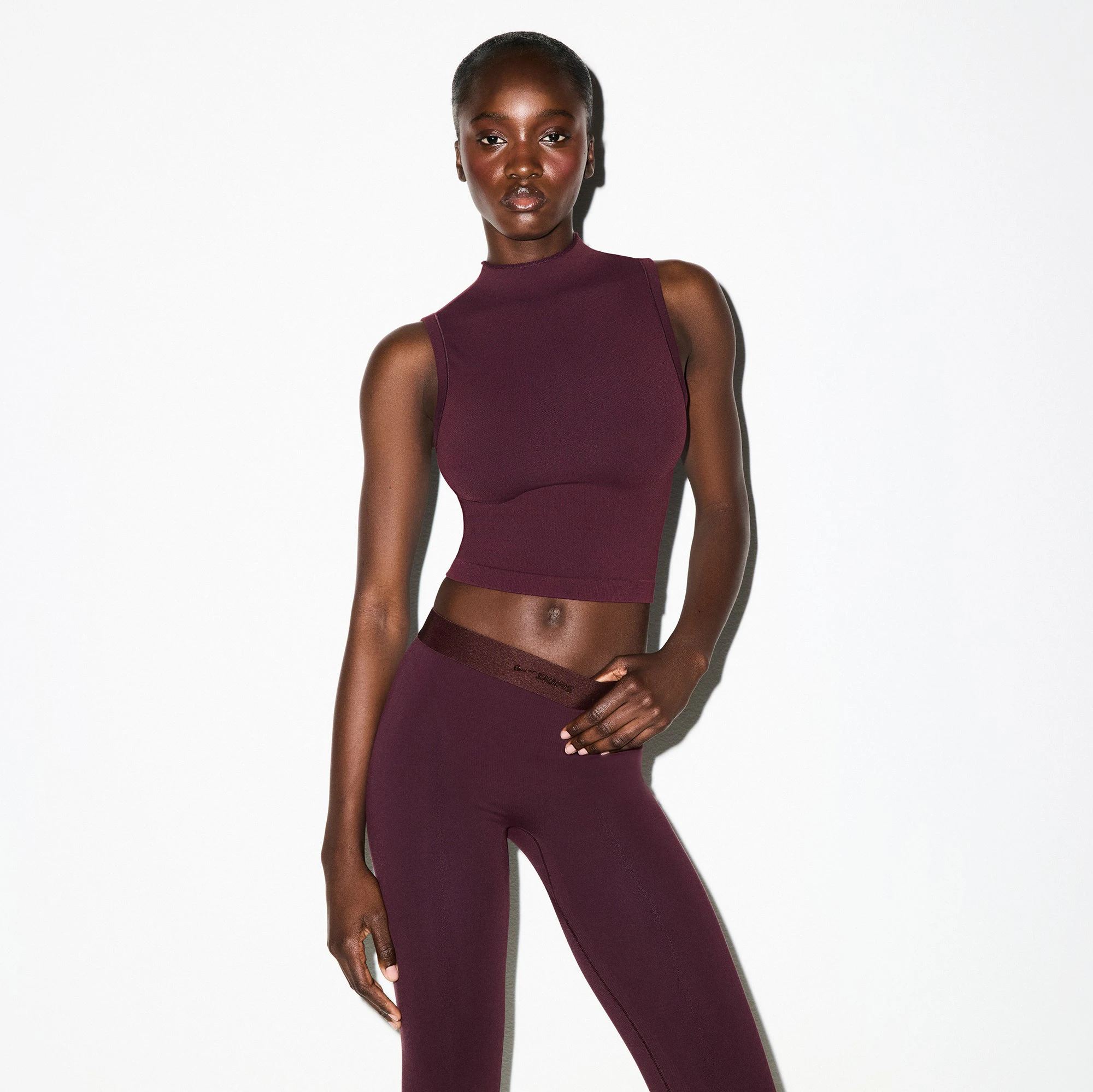 NikeSKIMS VINTAGE SEAMLESS MOCK NECK BRA TOP | CURRANT ON A MODEL FRONT VIEW @ | FOCUS: 0.0, 1.0, 0.9