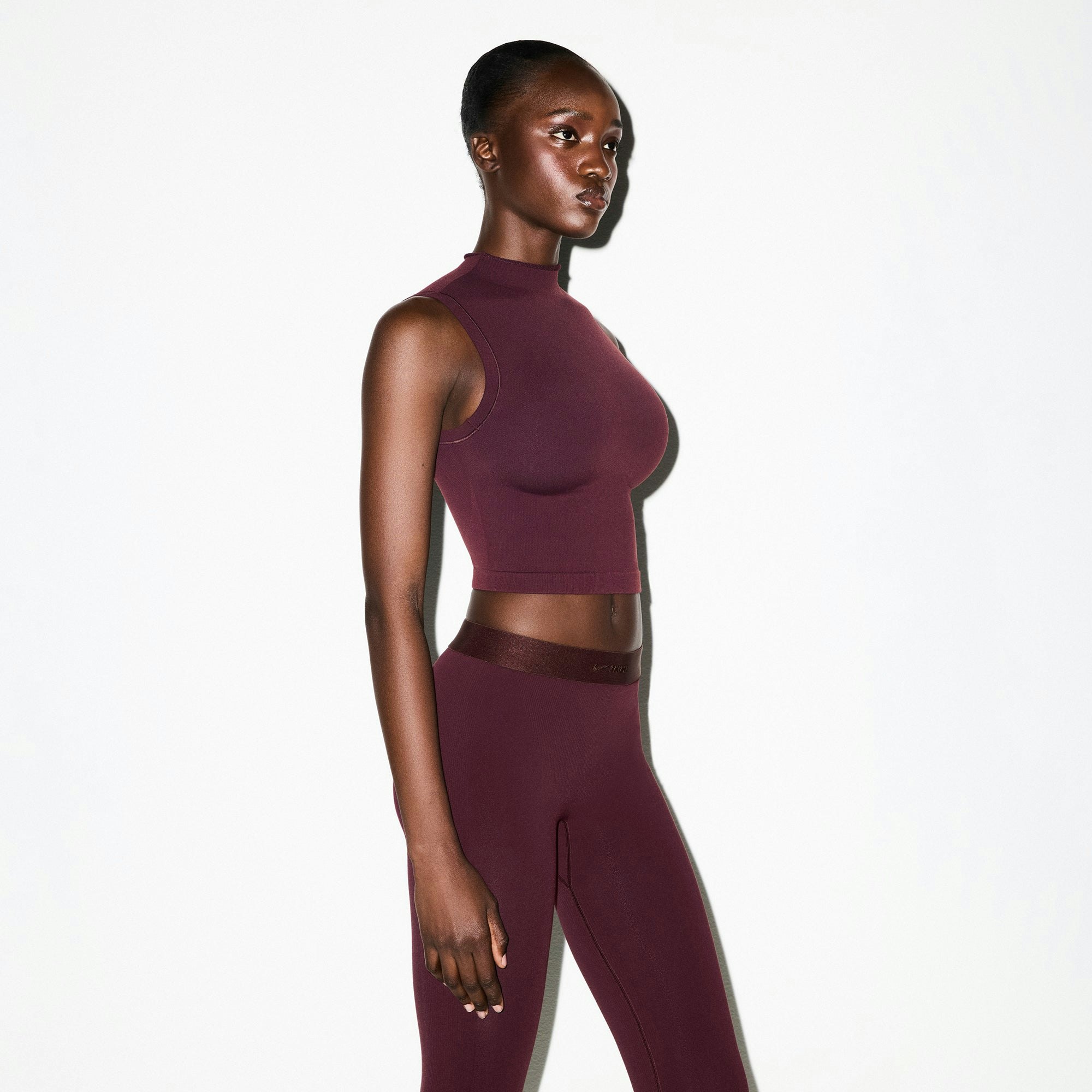 NikeSKIMS VINTAGE SEAMLESS MOCK NECK BRA TOP | CURRANT ON A MODEL FRONT VIEW @ | FOCUS: 0.0, 1.0, 0.9