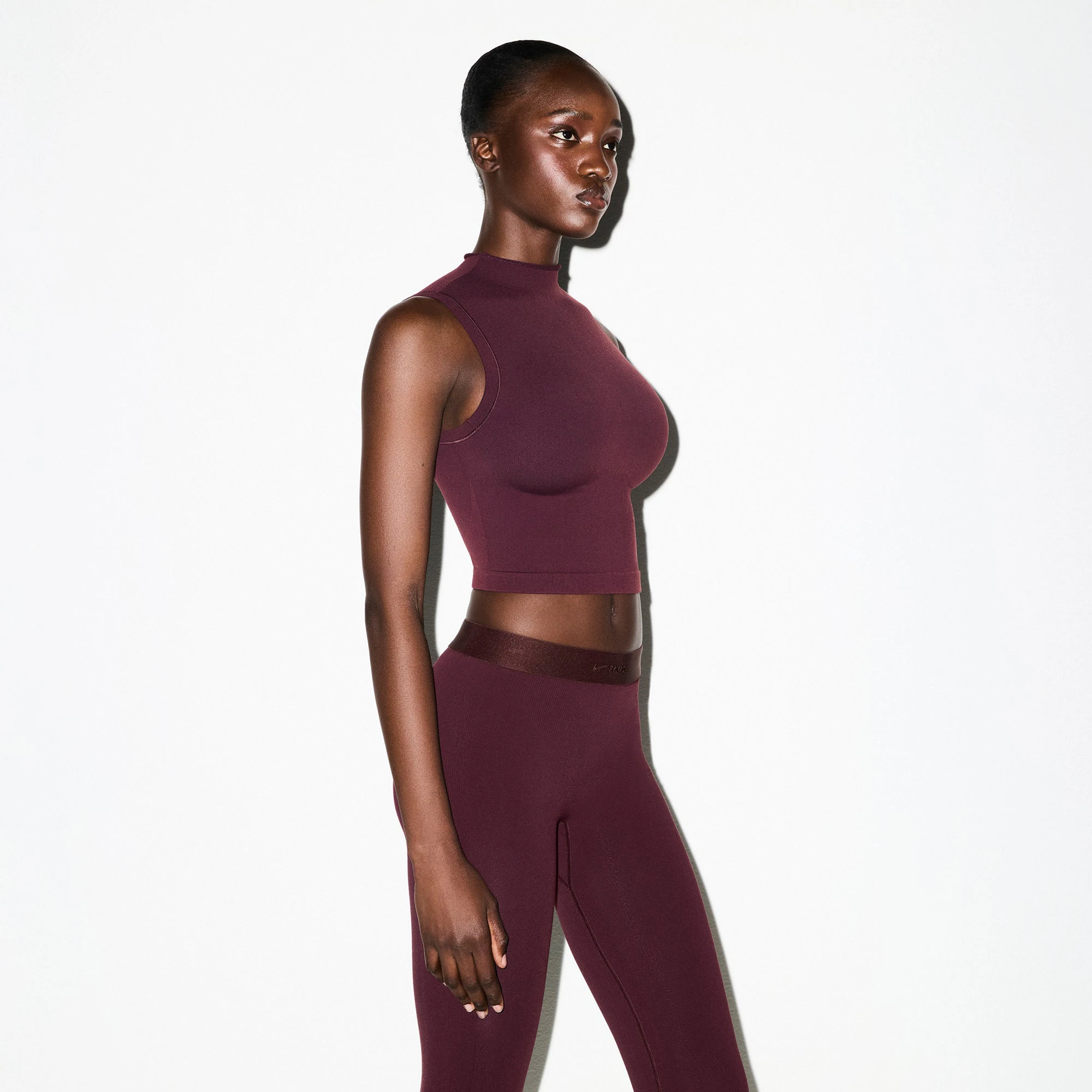 NikeSKIMS VINTAGE SEAMLESS MOCK NECK BRA TOP | CURRANT ON A MODEL FRONT VIEW @ | FOCUS: 0.0, 1.0, 0.9