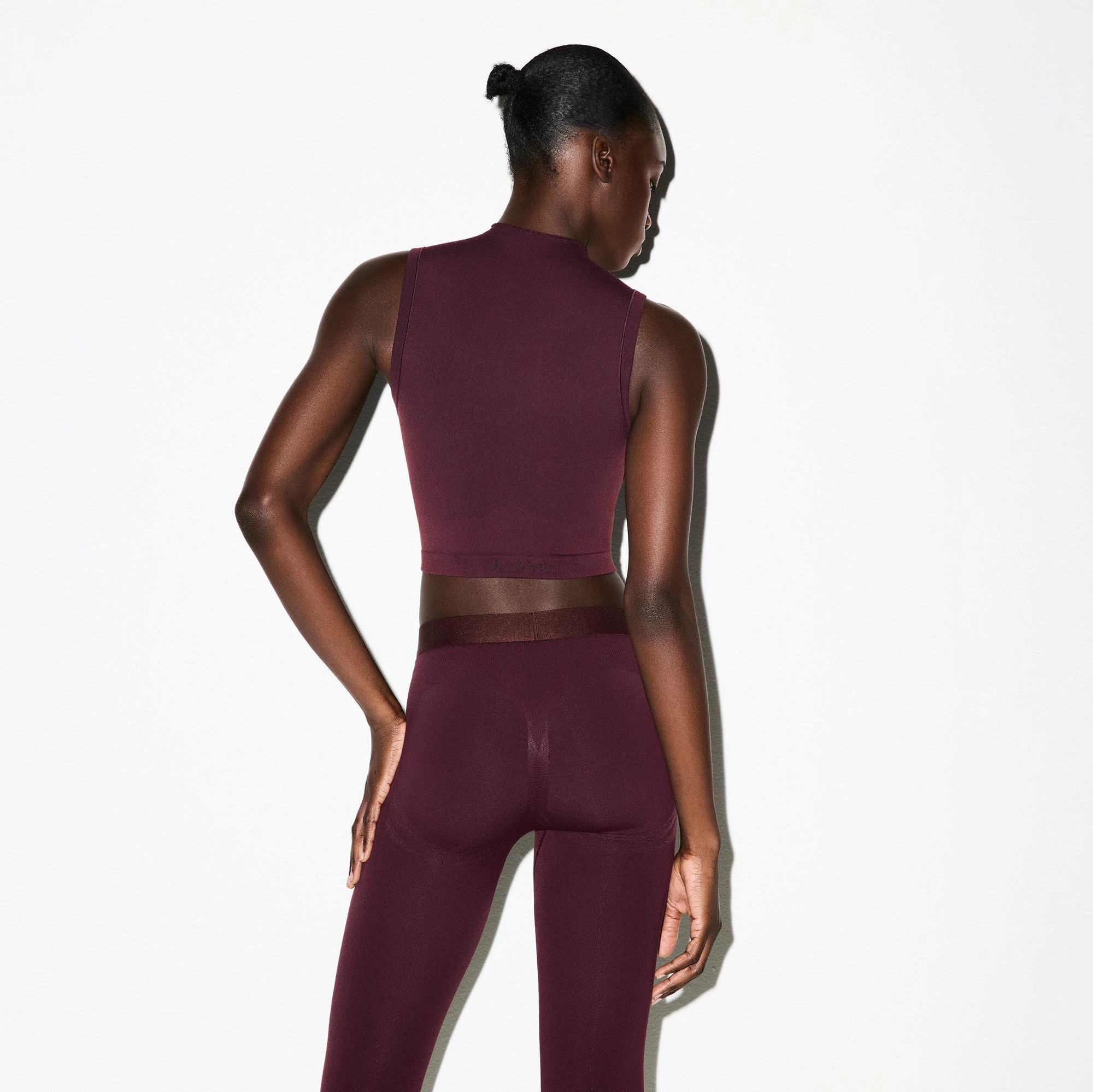 NikeSKIMS VINTAGE SEAMLESS MOCK NECK BRA TOP | CURRANT ON A MODEL FRONT VIEW @ | FOCUS: 0.0, 1.0, 0.9