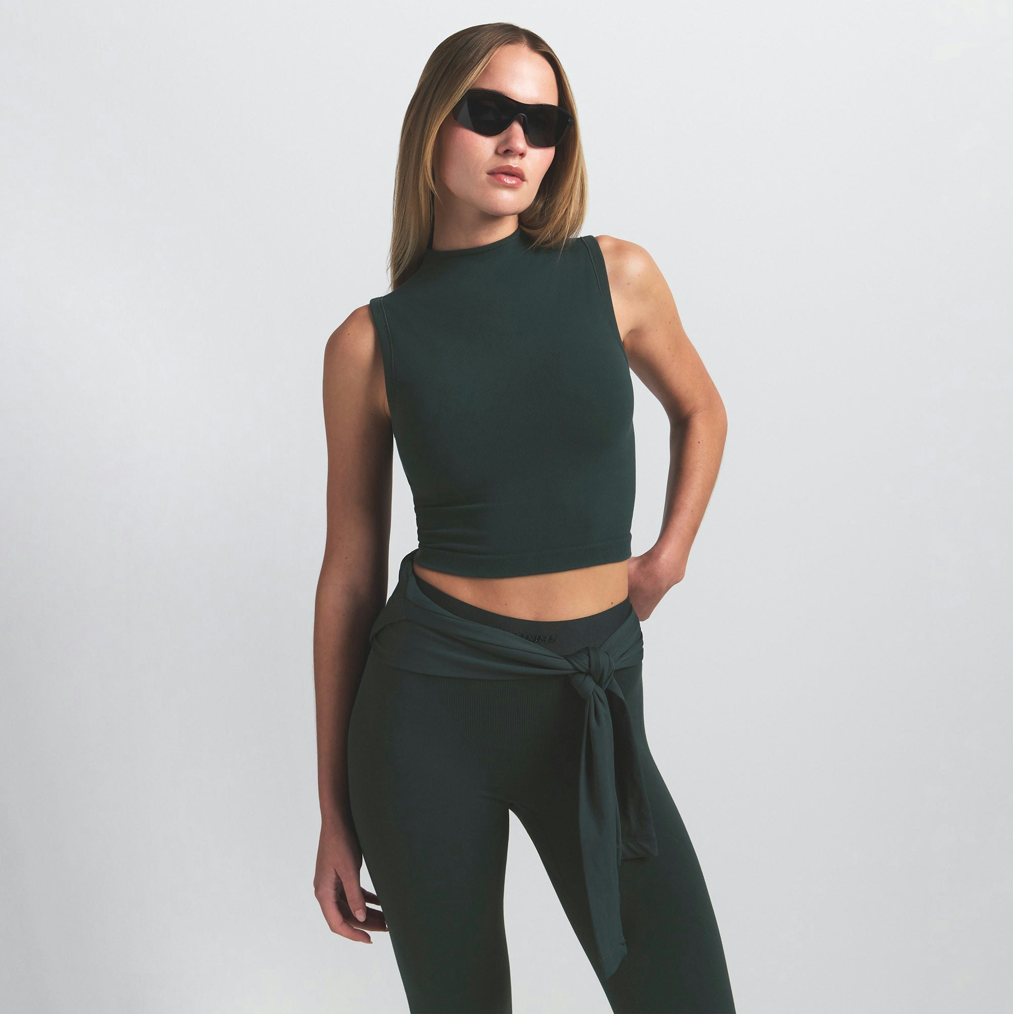 NikeSKIMS VINTAGE SEAMLESS MOCK NECK BRA TOP | DARK TEAL ON A MODEL SIDE VIEW @ | FOCUS: 0.0, 1.0, 0.9