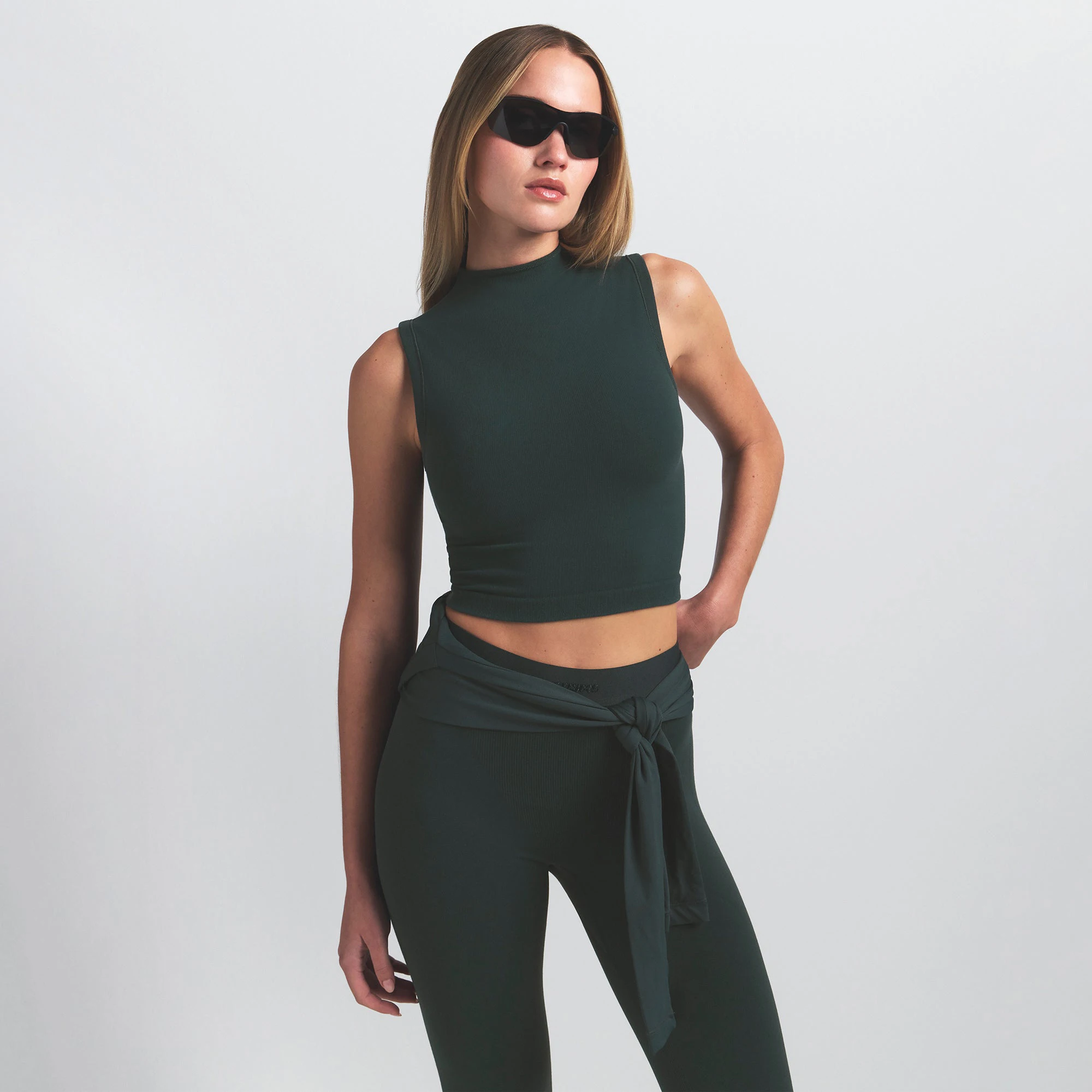 NikeSKIMS VINTAGE SEAMLESS MOCK NECK BRA TOP | DARK TEAL ON A MODEL SIDE VIEW @ | FOCUS: 0.0, 1.0, 0.9