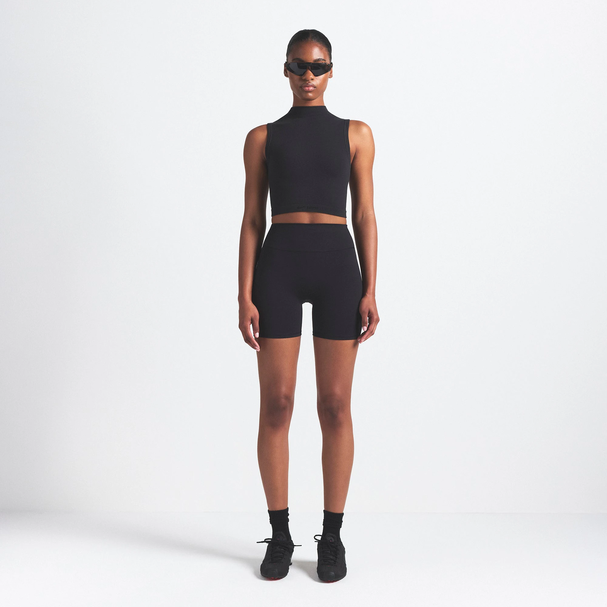 NikeSKIMS VINTAGE SEAMLESS MOCK NECK BRA TOP | OBSIDIAN ON A MODEL FRONT VIEW @ | FOCUS: 0.9, 0.1, 0.7