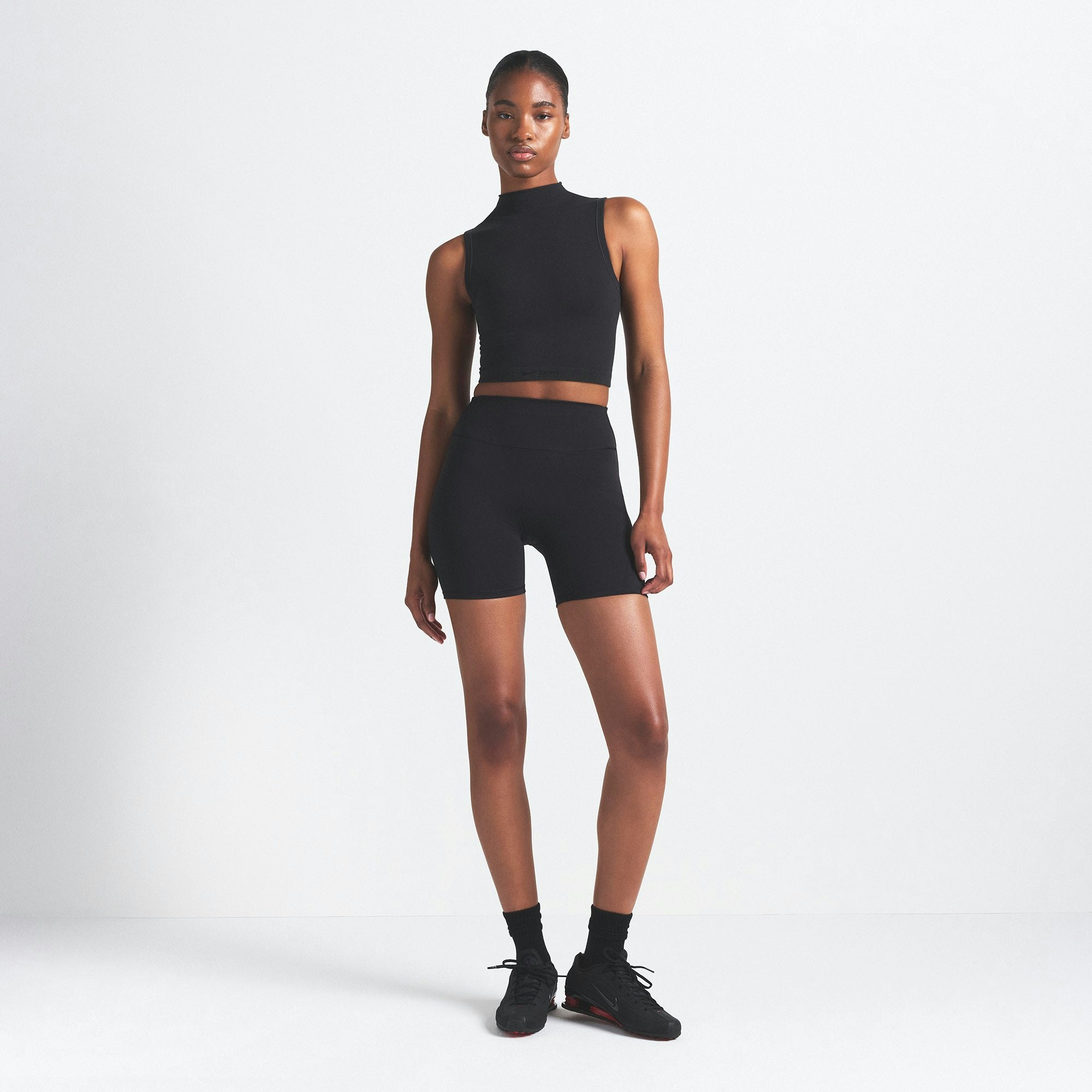 NikeSKIMS VINTAGE SEAMLESS MOCK NECK BRA TOP | OBSIDIAN ON A MODEL FRONT VIEW