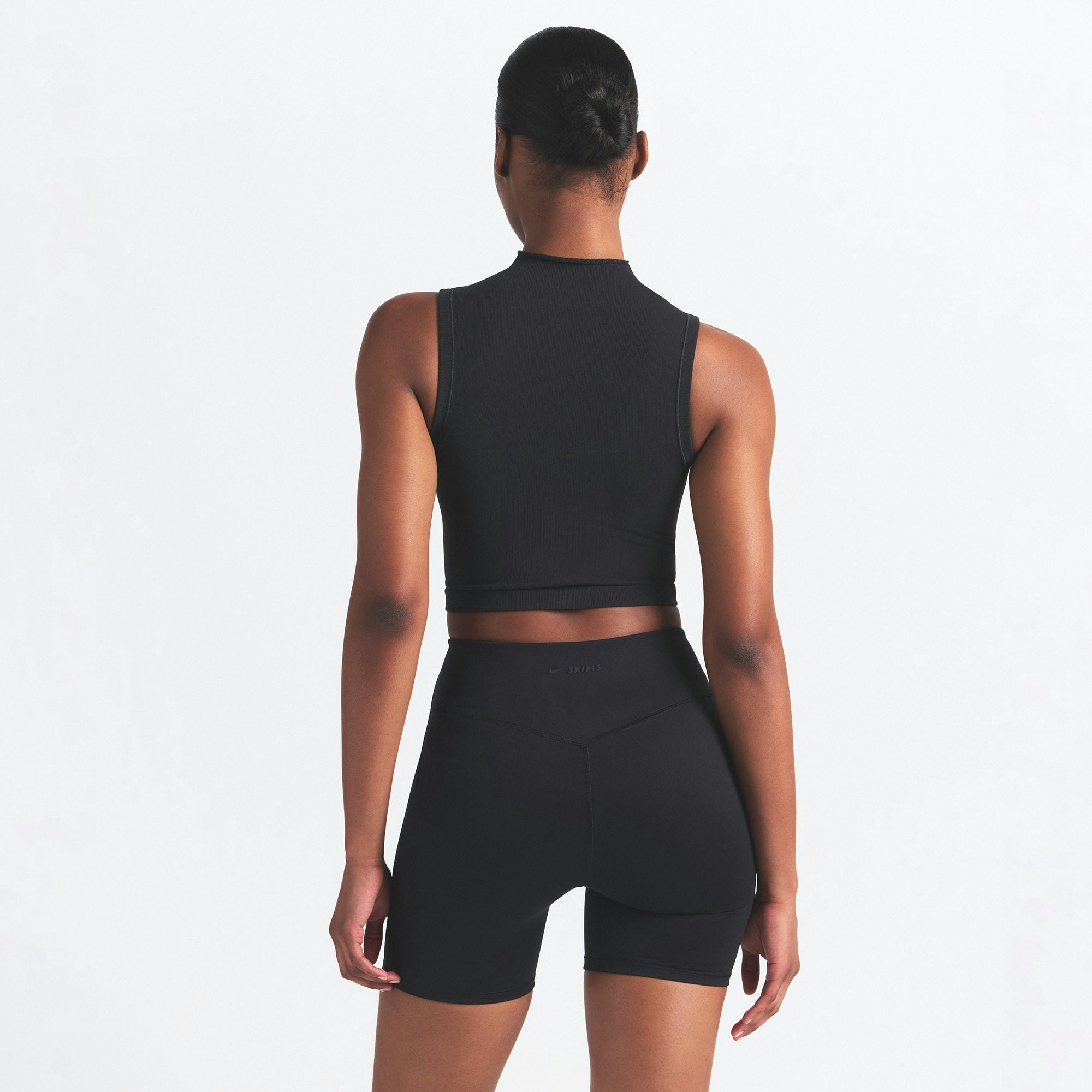 NikeSKIMS VINTAGE SEAMLESS MOCK NECK BRA TOP | OBSIDIAN ON A MODEL SIDE VIEW