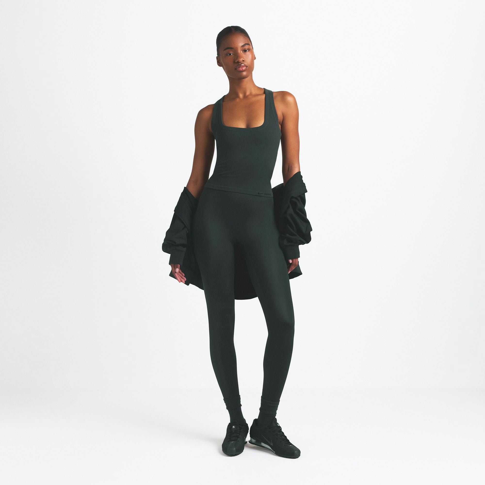 NikeSKIMS VINTAGE SEAMLESS RACER BACK TANK | DARK TEAL ON A MODEL FRONT VIEW @ | FOCUS: 0.0, 1.0, 0.9