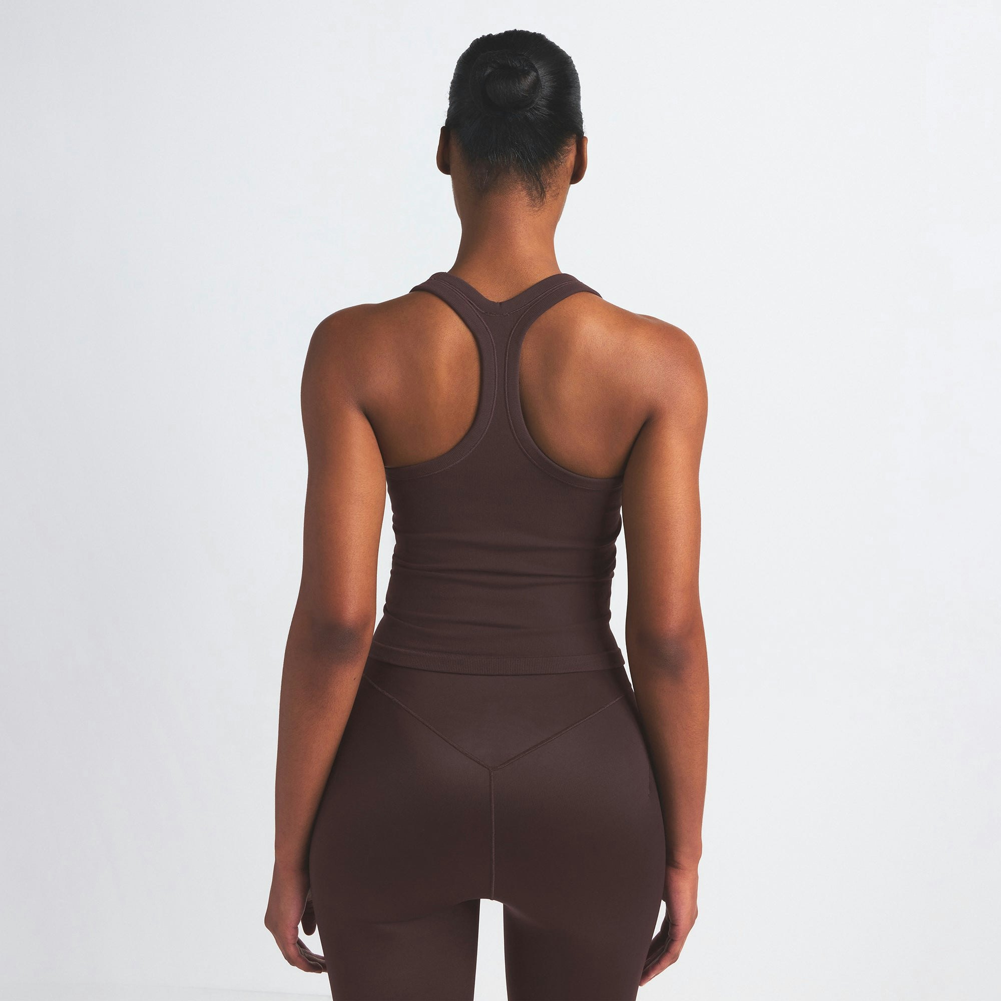 NikeSKIMS VINTAGE SEAMLESS RACER BACK TANK | PHOENIX ON A MODEL SIDE VIEW @ | FOCUS: 0.9, 0.1, 0.