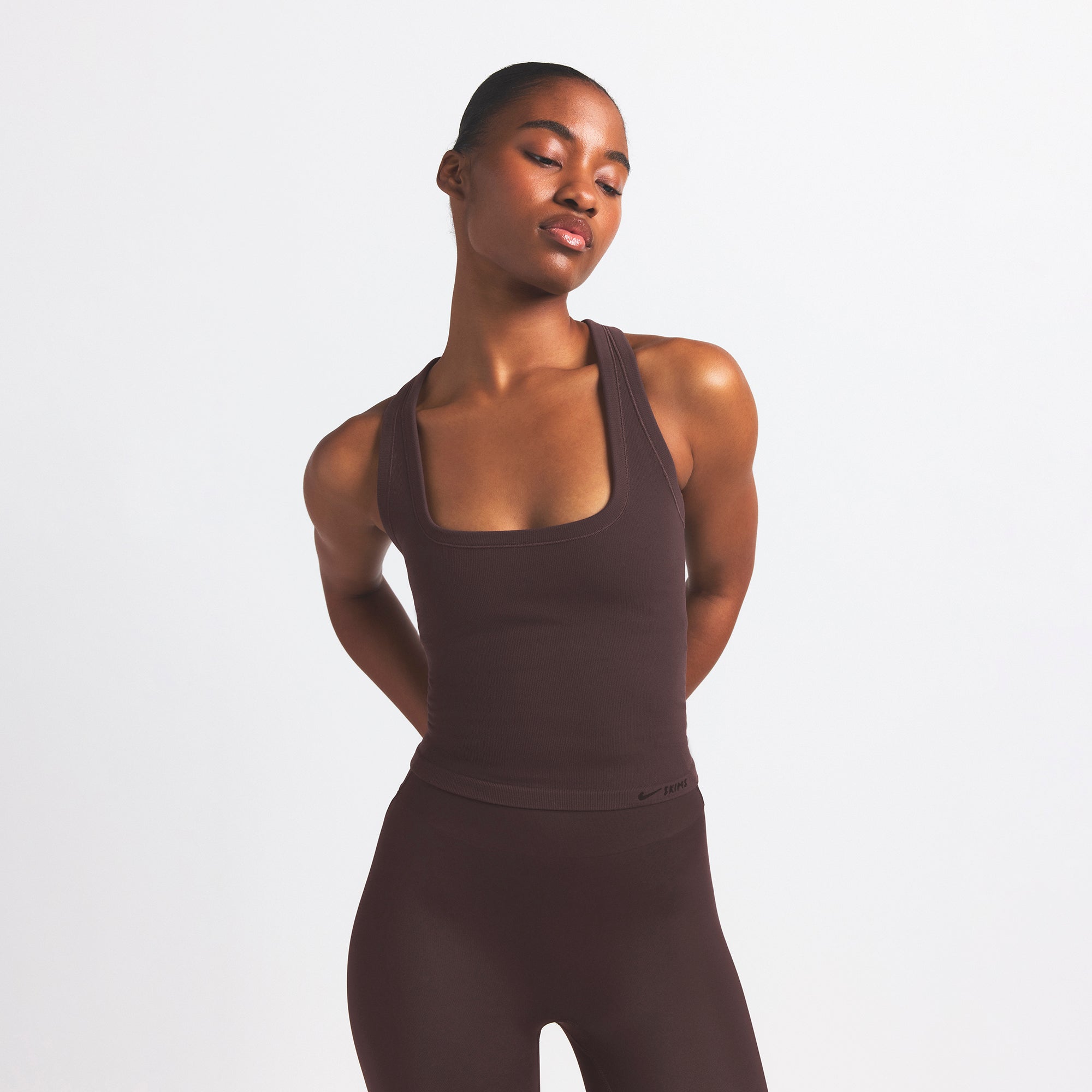 NikeSKIMS VINTAGE SEAMLESS RACER BACK TANK | PHOENIX ON A MODEL SIDE VIEW @ | FOCUS: 0.9, 0.1, 0.7