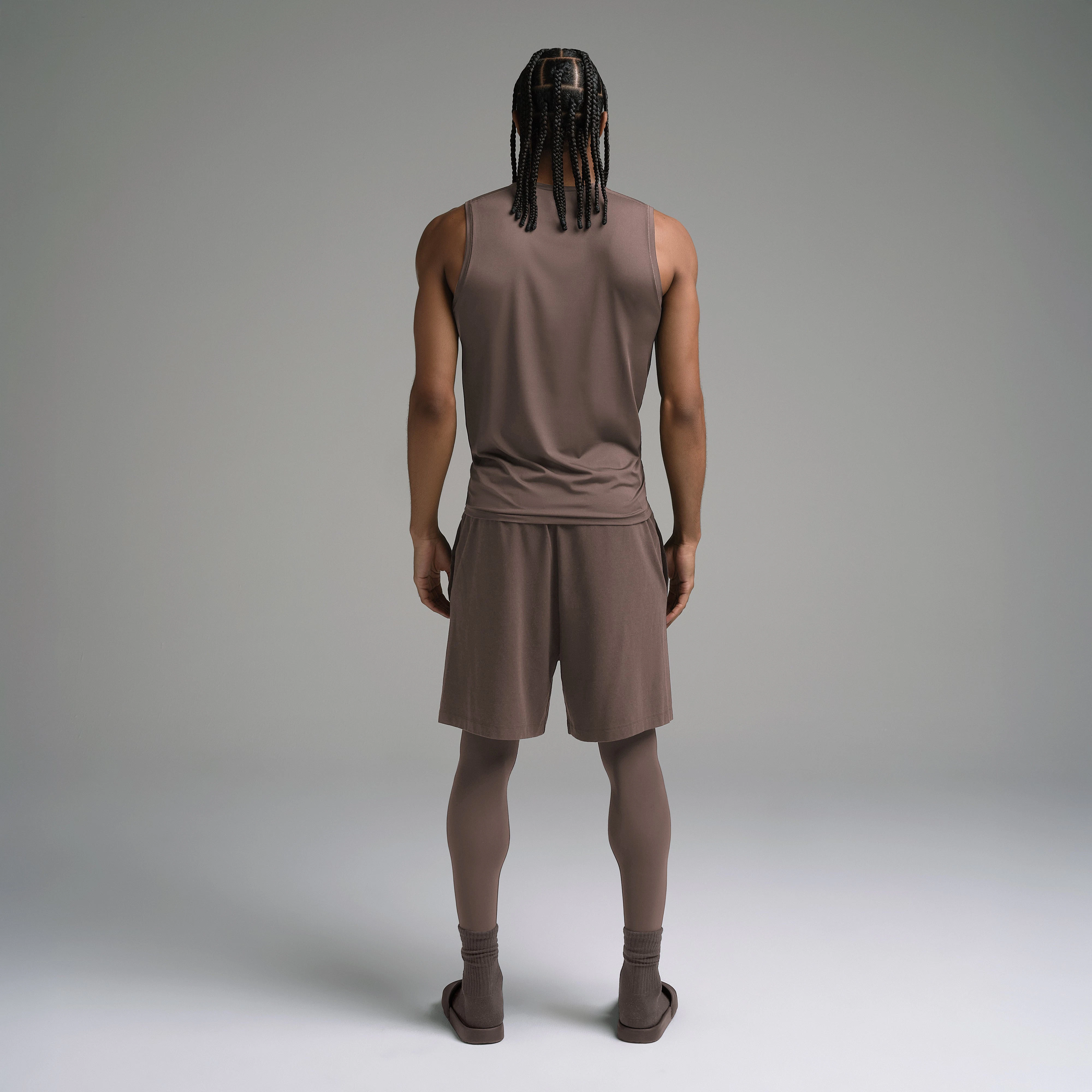 SKIMS SPORT MENS MUSCLE TANK | AMETHYST ON A MODEL SIDE VIEW | FOCUS: 0.0, 1.0, 0.9