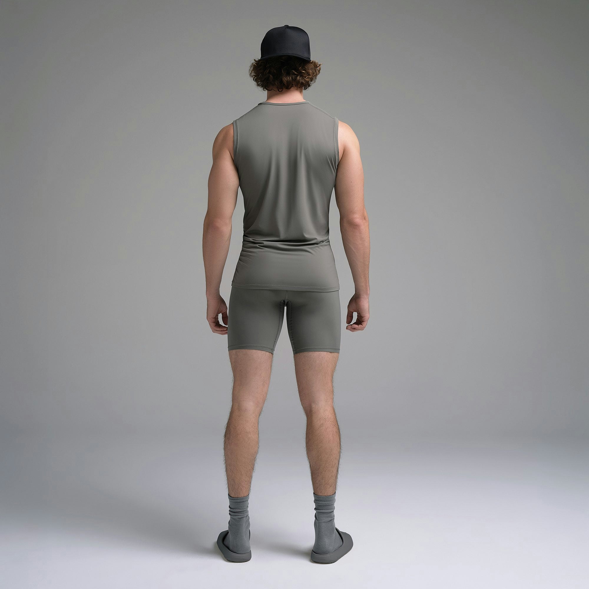 SKIMS SPORT MENS MUSCLE TANK | GUNMETAL ON A MODEL SIDE VIEW | FOCUS: 0.0, 1.0, 0.9