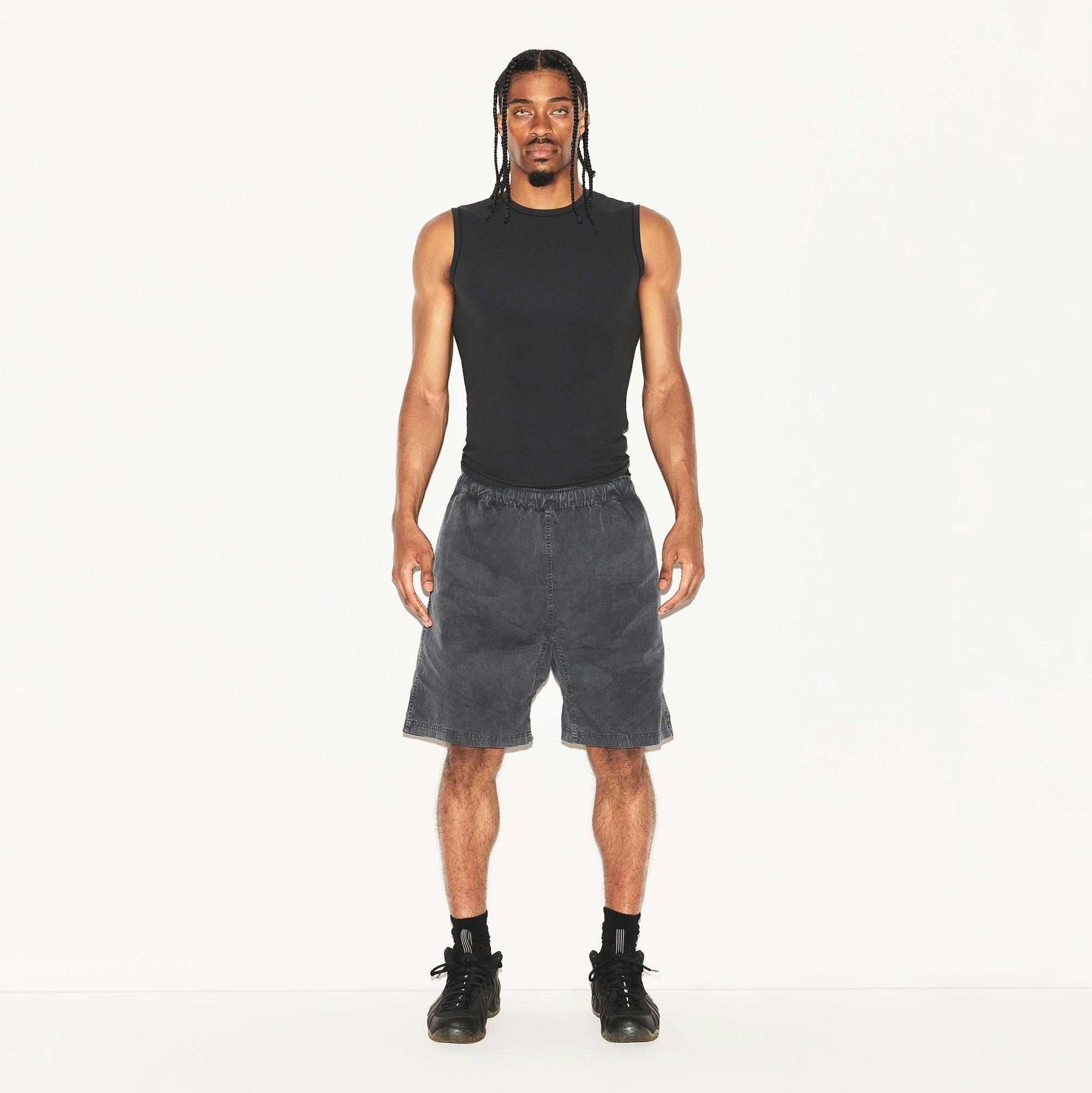 FITS EVERYBODY MENS SLIM TANK | ONYX ON A MODEL FRONT VIEW | FOCUS: 0.0, 1.0, 0.9