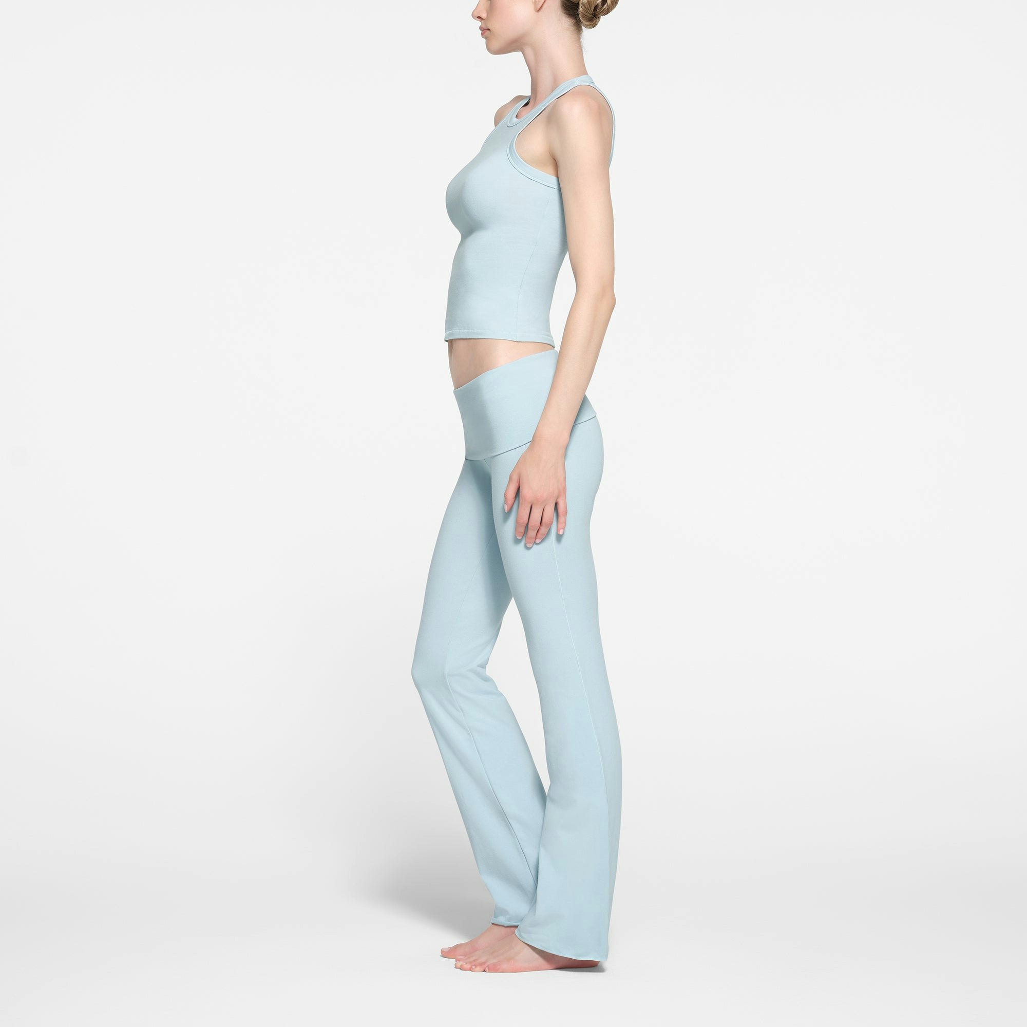 COTTON JERSEY HIGH NECK TANK | OPAL ON A MODEL SIDE VIEW