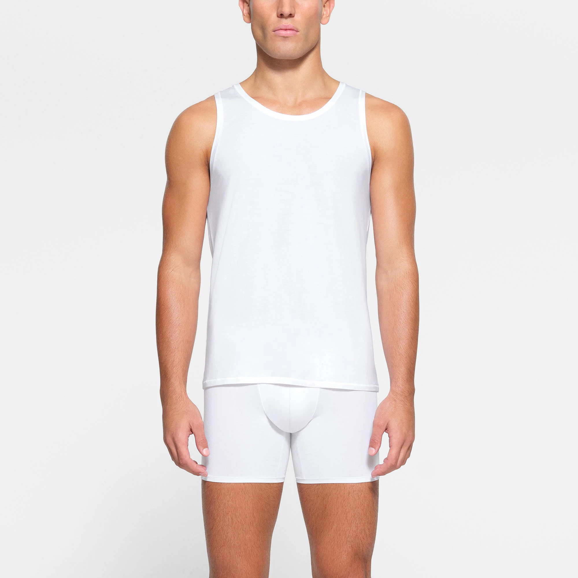 SKIMS STRETCH MENS TANK 3-PACK WORN BY A MODEL IN FRONT VIEW