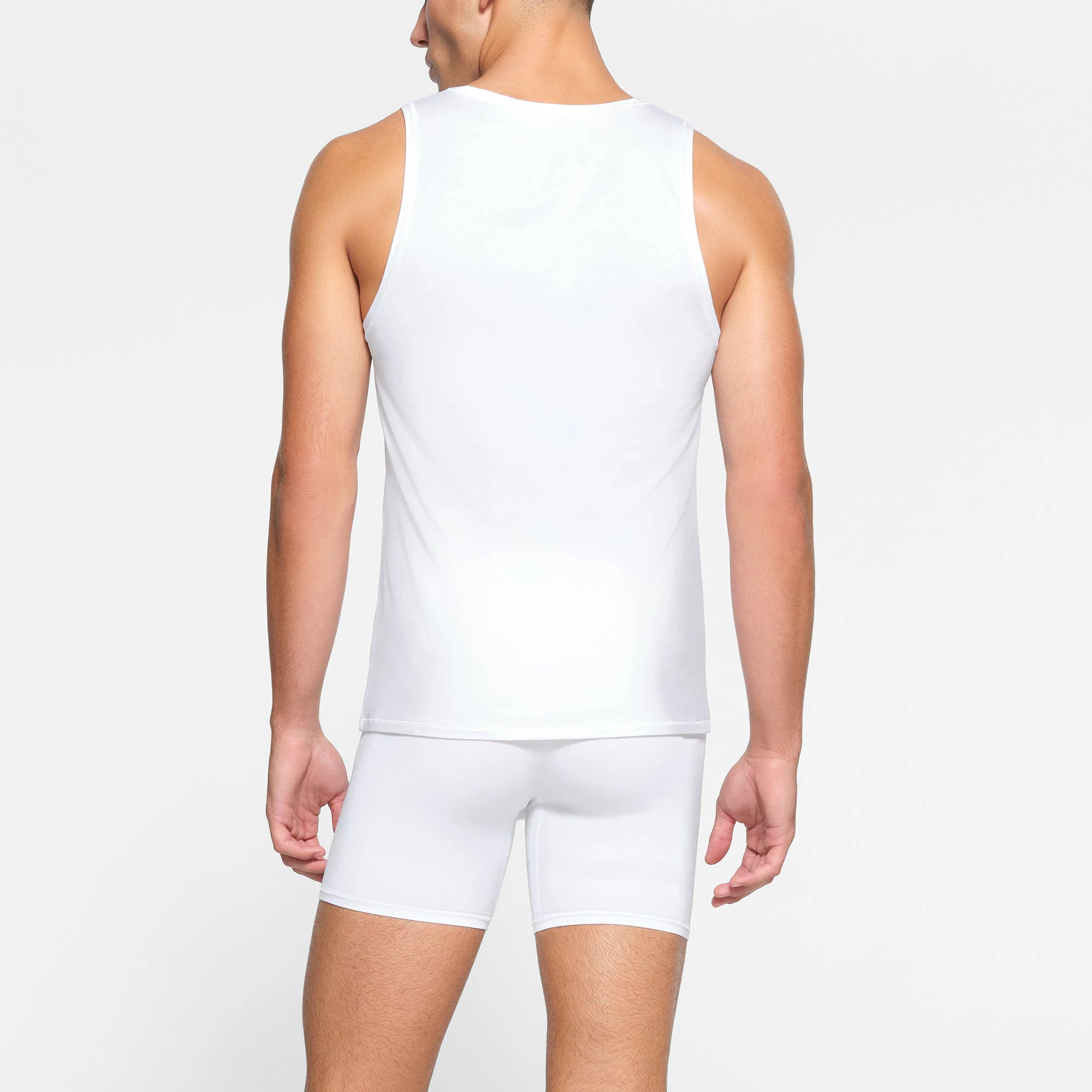 SKIMS STRETCH MENS TANK 3-PACK ON A MODEL BACK VIEW