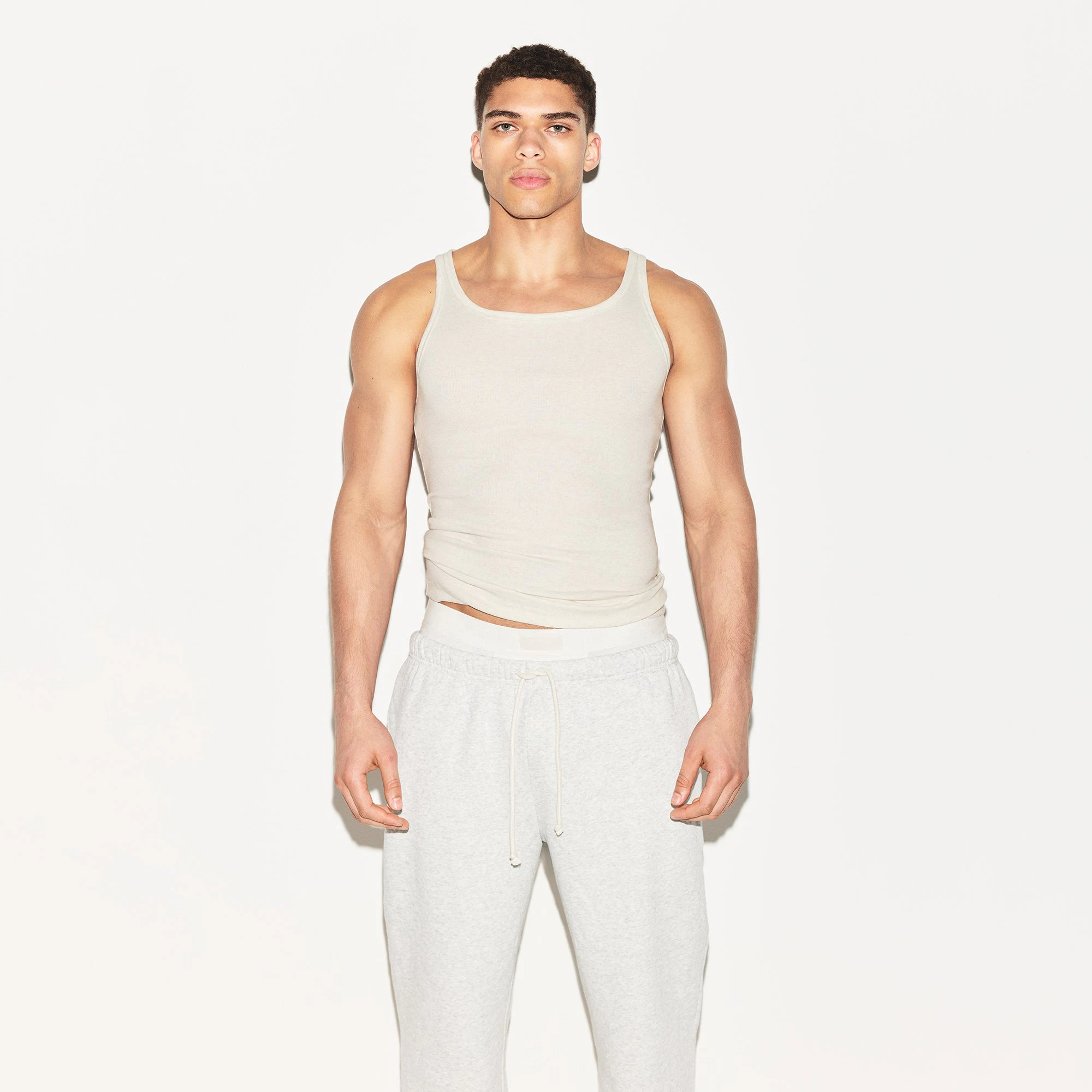 SKIMS COTTON MENS RIB TANK 3-PACK | ARMY MULTI ON A MODEL FRONT VIEW | FOCUS: 0.0, 1.0, 0.9