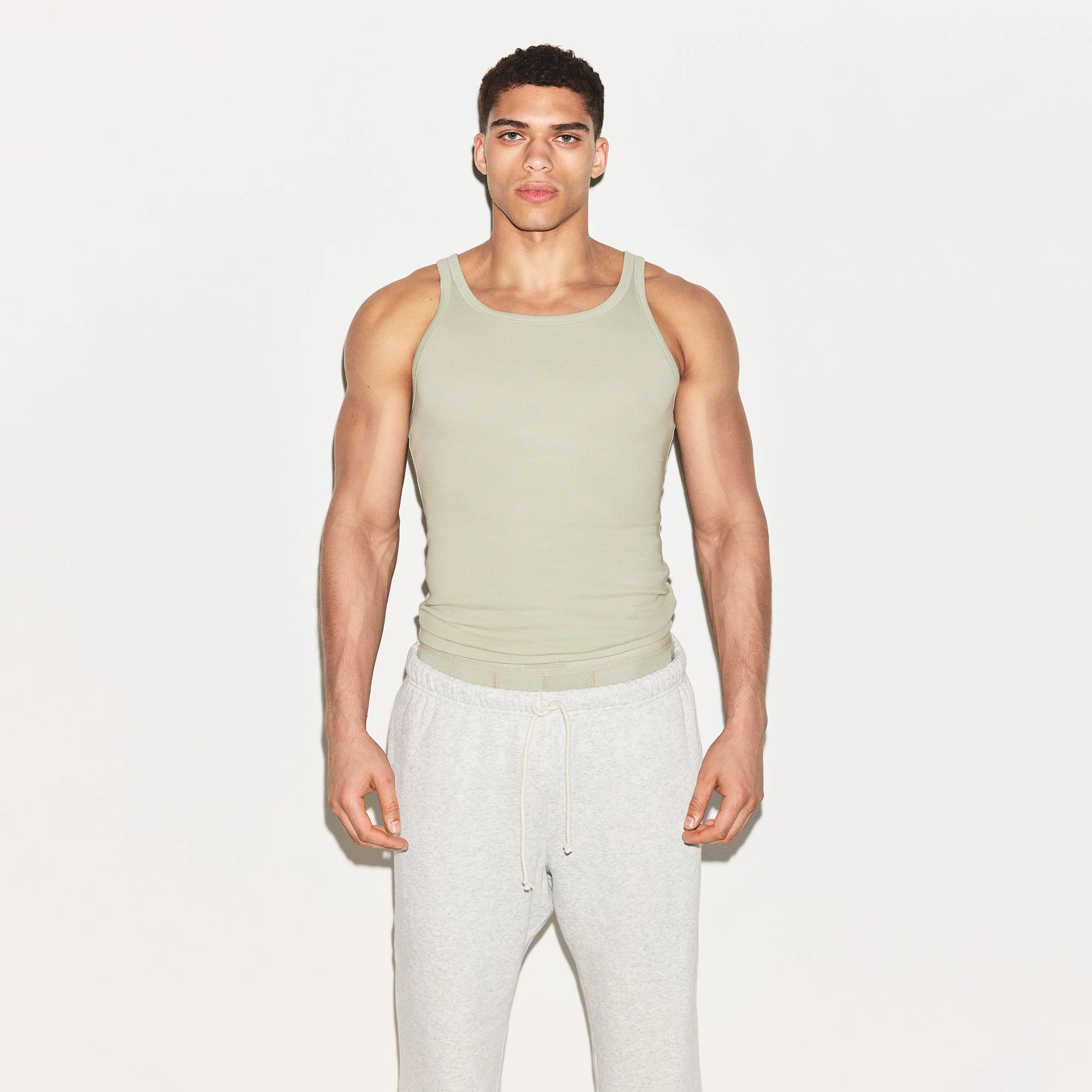 SKIMS COTTON MENS RIB TANK 3-PACK | ARMY MULTI ON A MODEL FRONT VIEW | FOCUS: 0.0, 1.0, 0.9