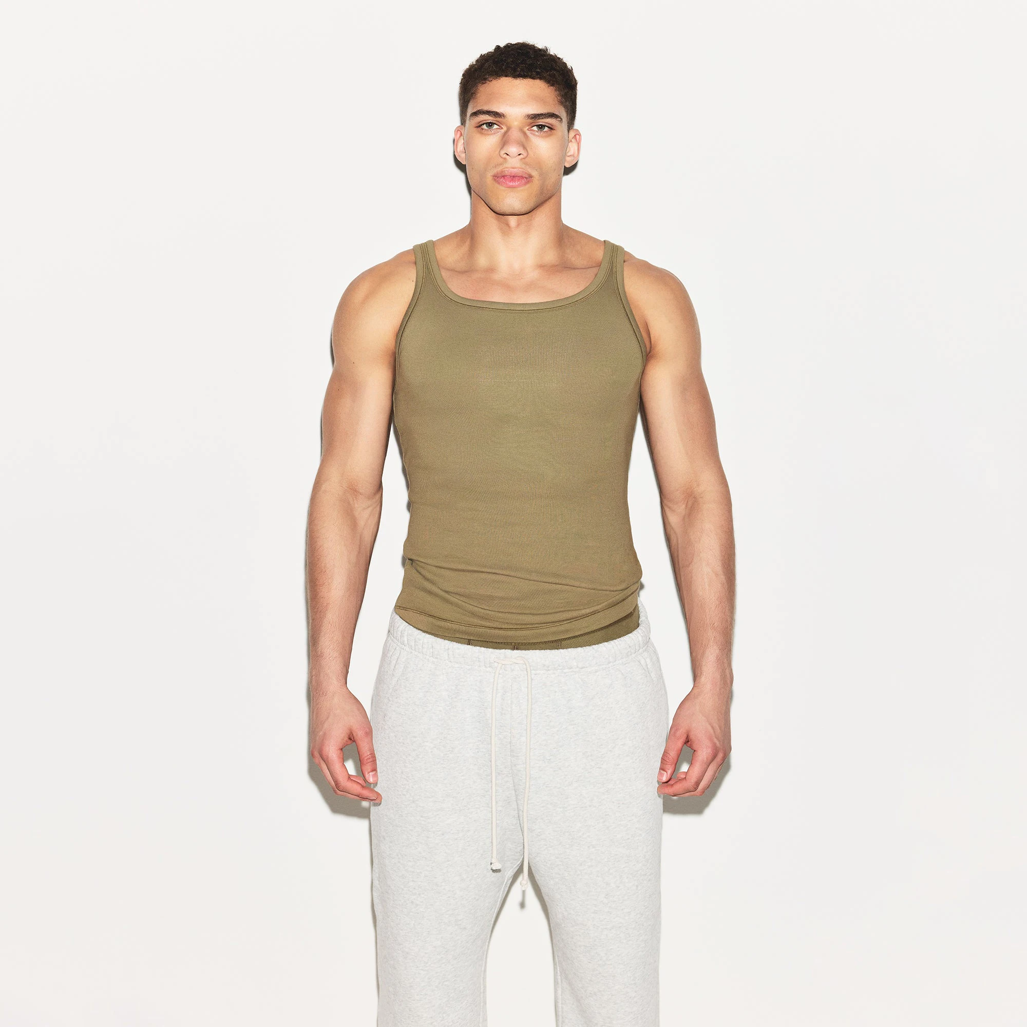 SKIMS COTTON MENS RIB TANK 3-PACK | ARMY MULTI ON A MODEL FRONT VIEW | FOCUS: 0.0, 1.0, 0.9