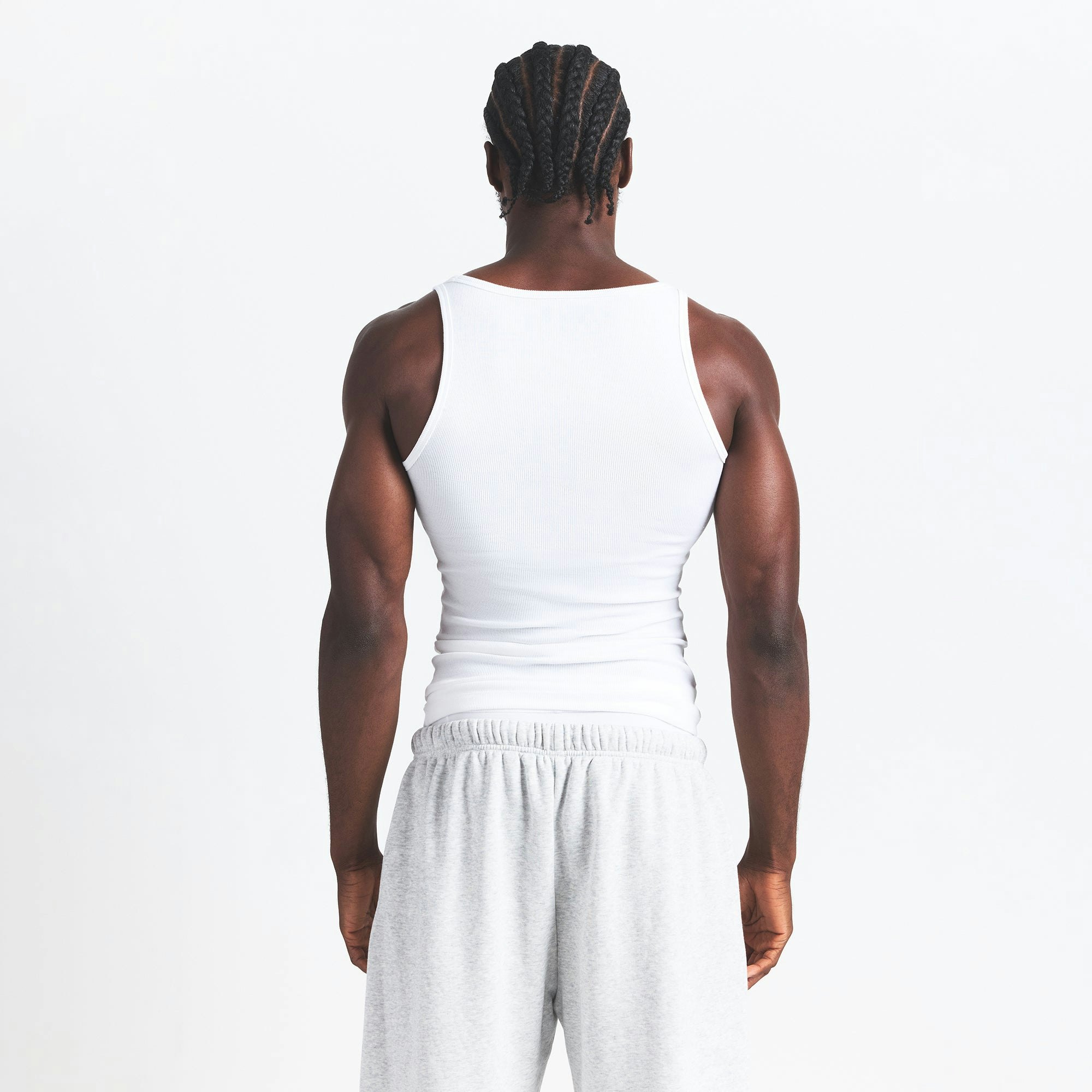 SKIMS Cotton MENS RIB TANK 3-PACK | DRIFTWOOD MULTI ON A MODEL BACK VIEW @ | FOCUS: 0.0, 1.0, 0.9