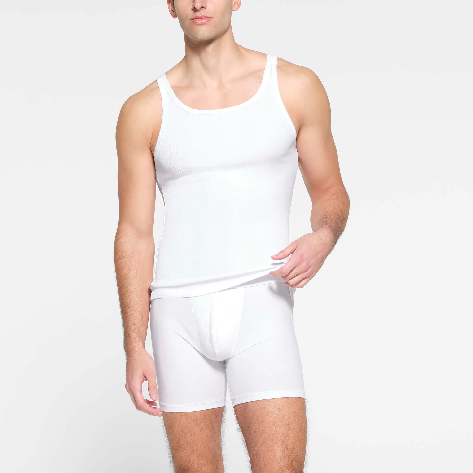 SKIMS COTTON MENS RIB TANK 3-PACK | CHALK ON A MODEL FRONT VIEW