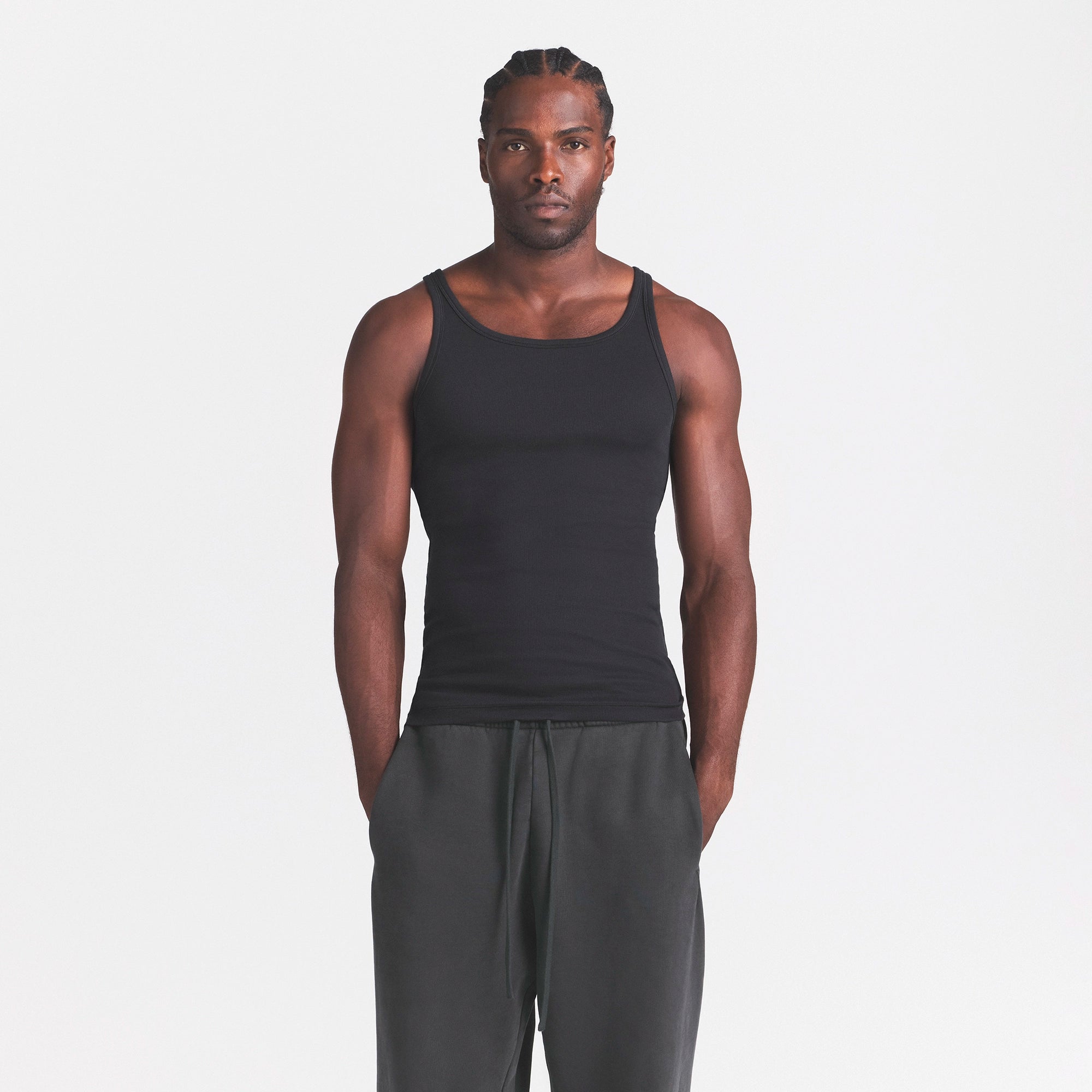 SKIMS COTTON MENS RIB TANK 3-PACK | CURRANT STERLING MULTI ON A MODEL SIDE VIEW @ | FOCUS: 0.0, 1.0, 0.9