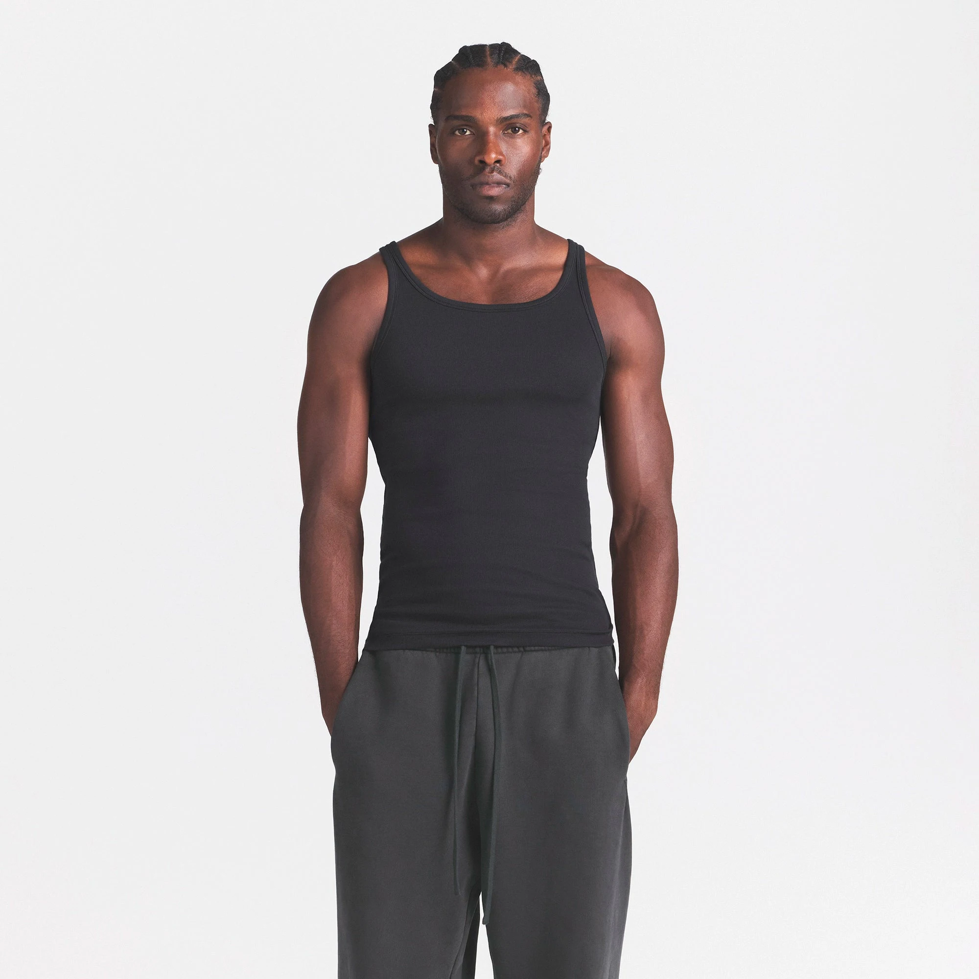SKIMS COTTON MENS RIB TANK 3-PACK | CURRANT STERLING MULTI ON A MODEL SIDE VIEW @ | FOCUS: 0.0, 1.0, 0.9