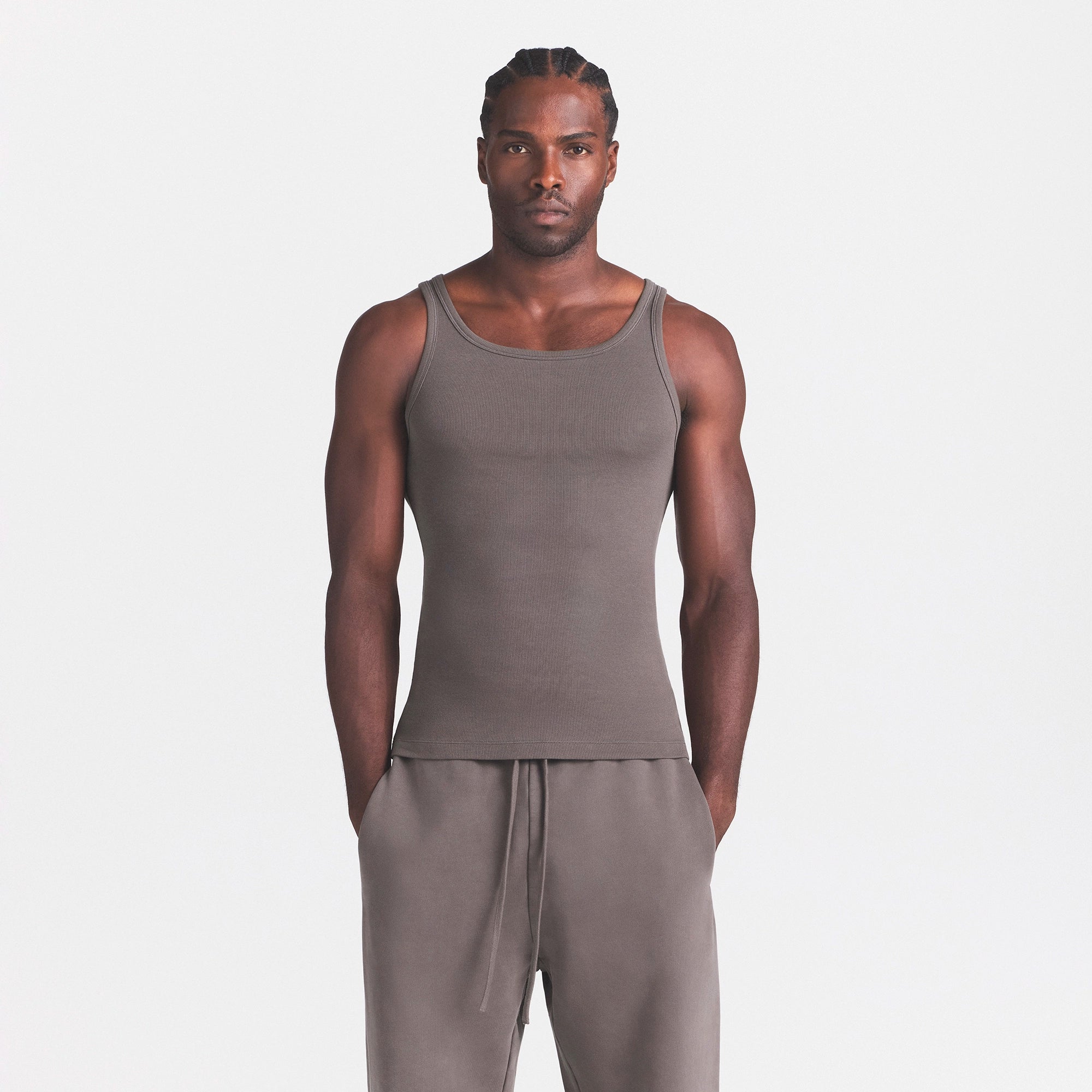 SKIMS COTTON MENS RIB TANK 3-PACK | CURRANT STERLING MULTI ON A MODEL SIDE VIEW @ | FOCUS: 0.0, 1.0, 0.9