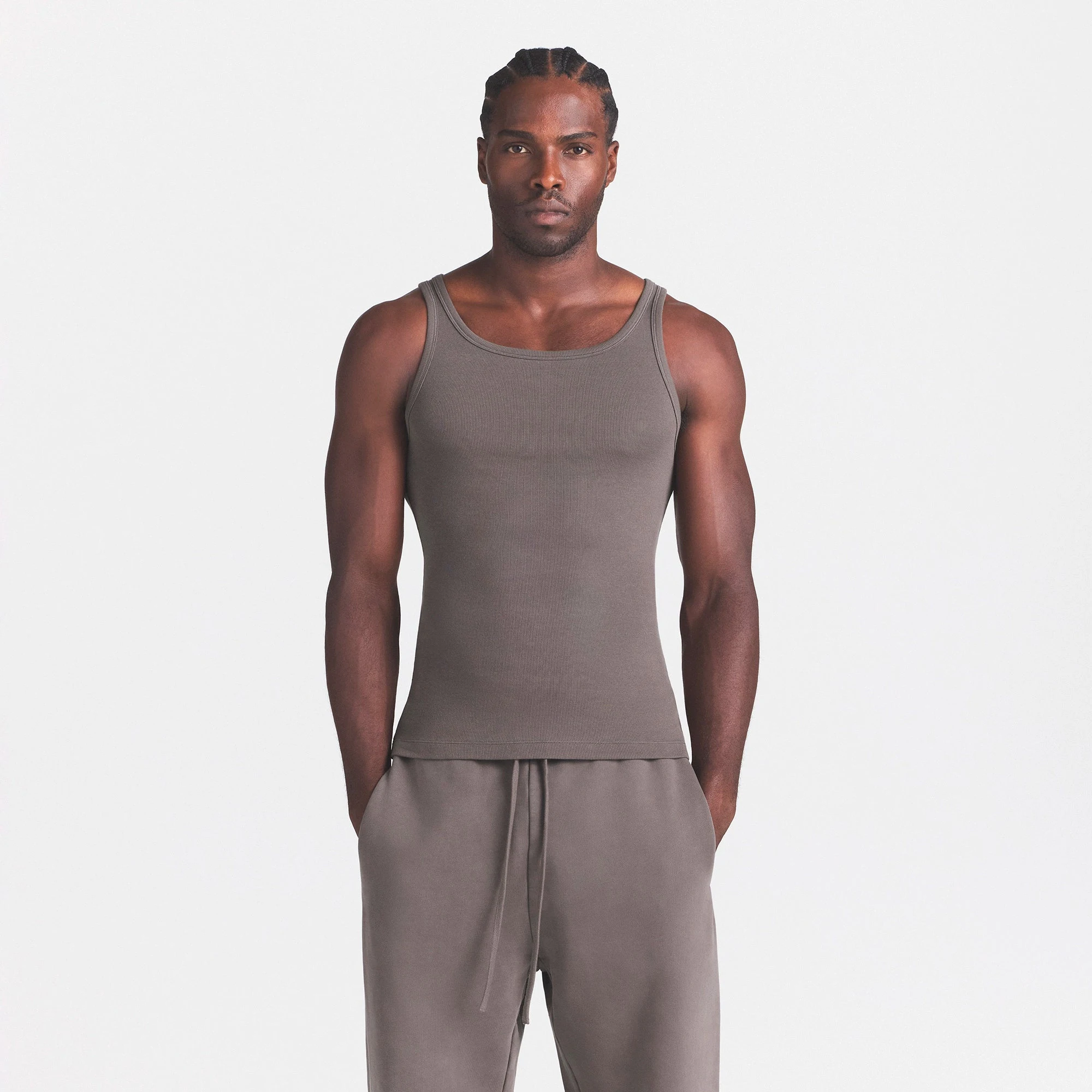 SKIMS COTTON MENS RIB TANK 3-PACK | CURRANT STERLING MULTI ON A MODEL SIDE VIEW @ | FOCUS: 0.0, 1.0, 0.9