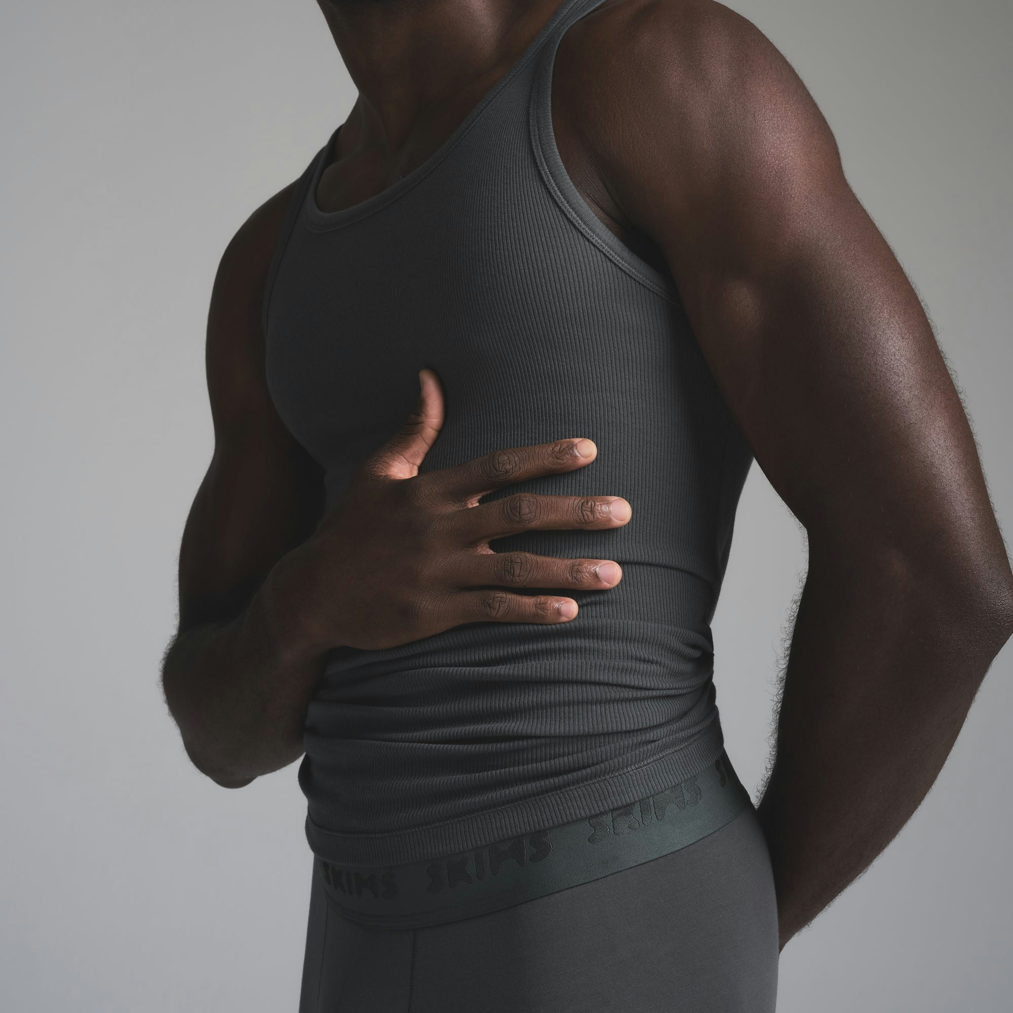 SKIMS BODY CORE SCULPT PLUNGE MID THIGH BODYSUIT | SAND (MENS BUNDLES) FLAT ON A WHITE BACKGROUND | FLT