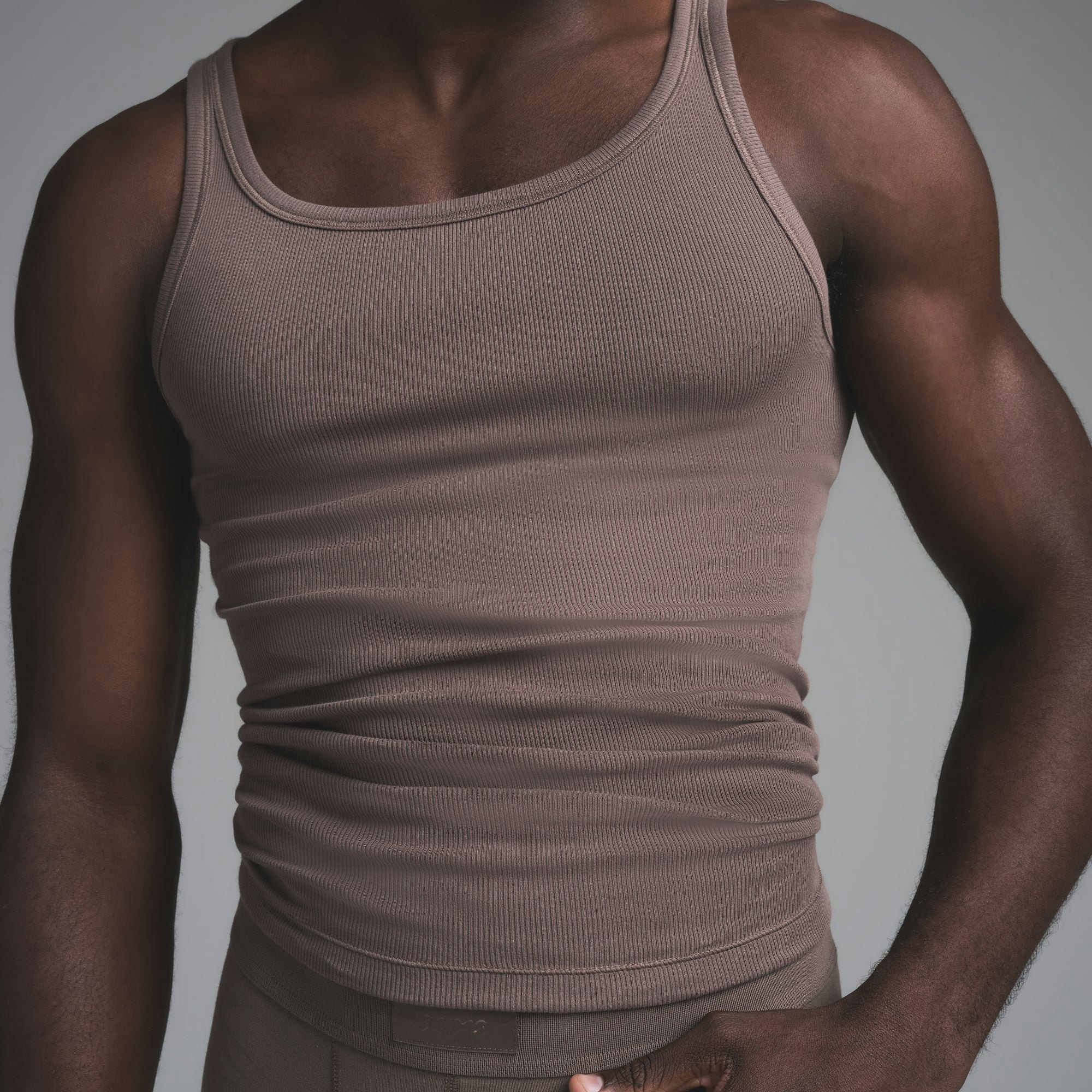 SKIMS COTTON MENS RIB TANK 3-PACK | DEEP SEA MULTI ON A MODEL SIDE VIEW