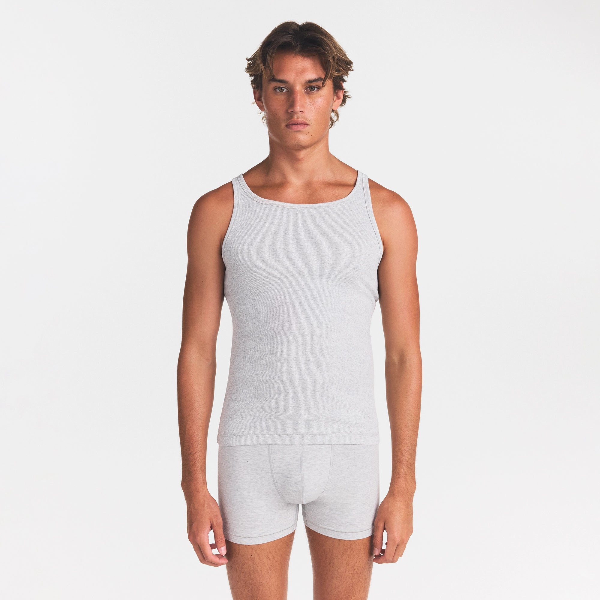 SKIMS COTTON MENS RIB TANK 3-PACK | ECRU MULTI ON A MODEL FRONT VIEW