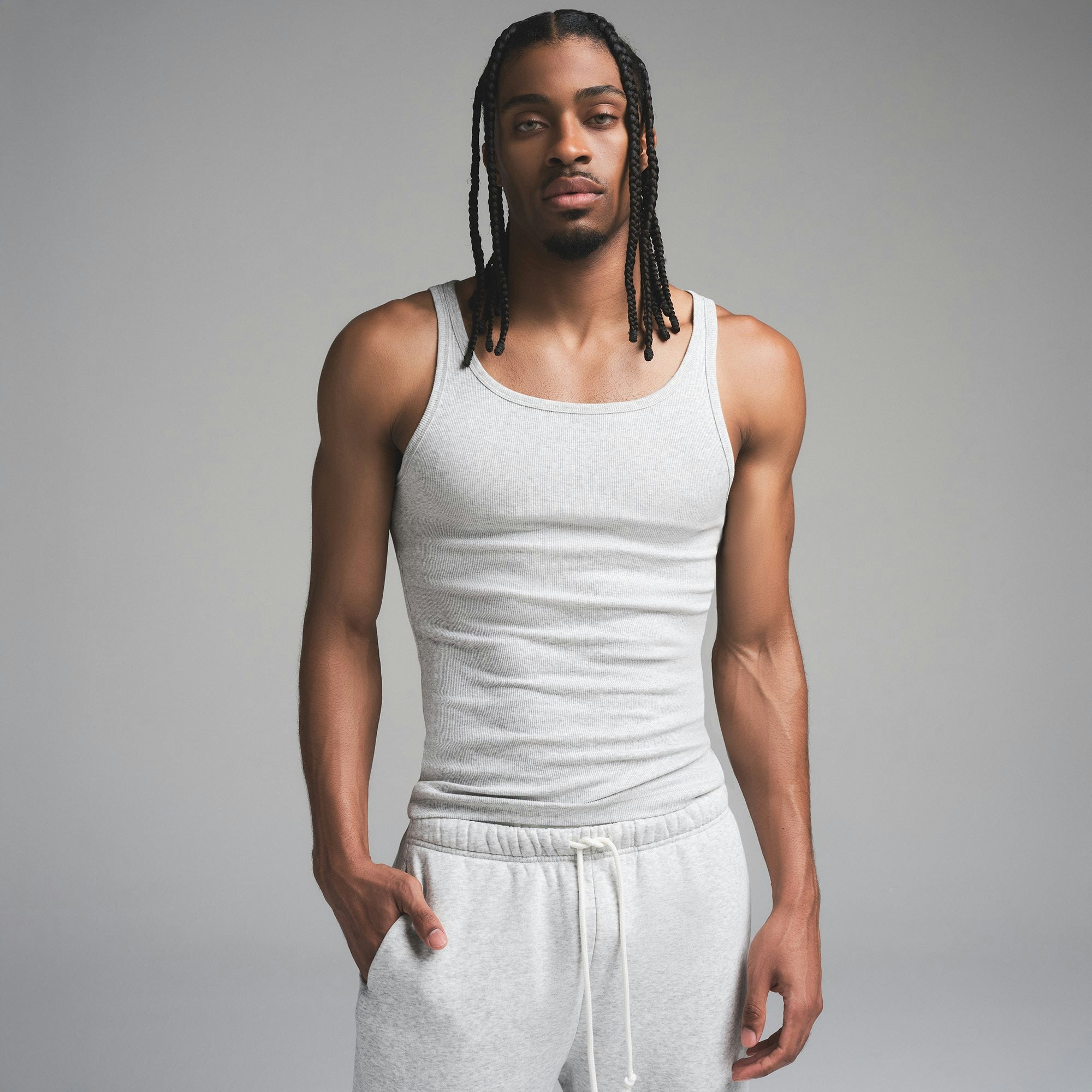 SKIMS COTTON MENS RIB TANK 3-PACK | ECRU MULTI ON A MODEL SIDE VIEW | FOCUS: 0.0, 1.0, 0.9