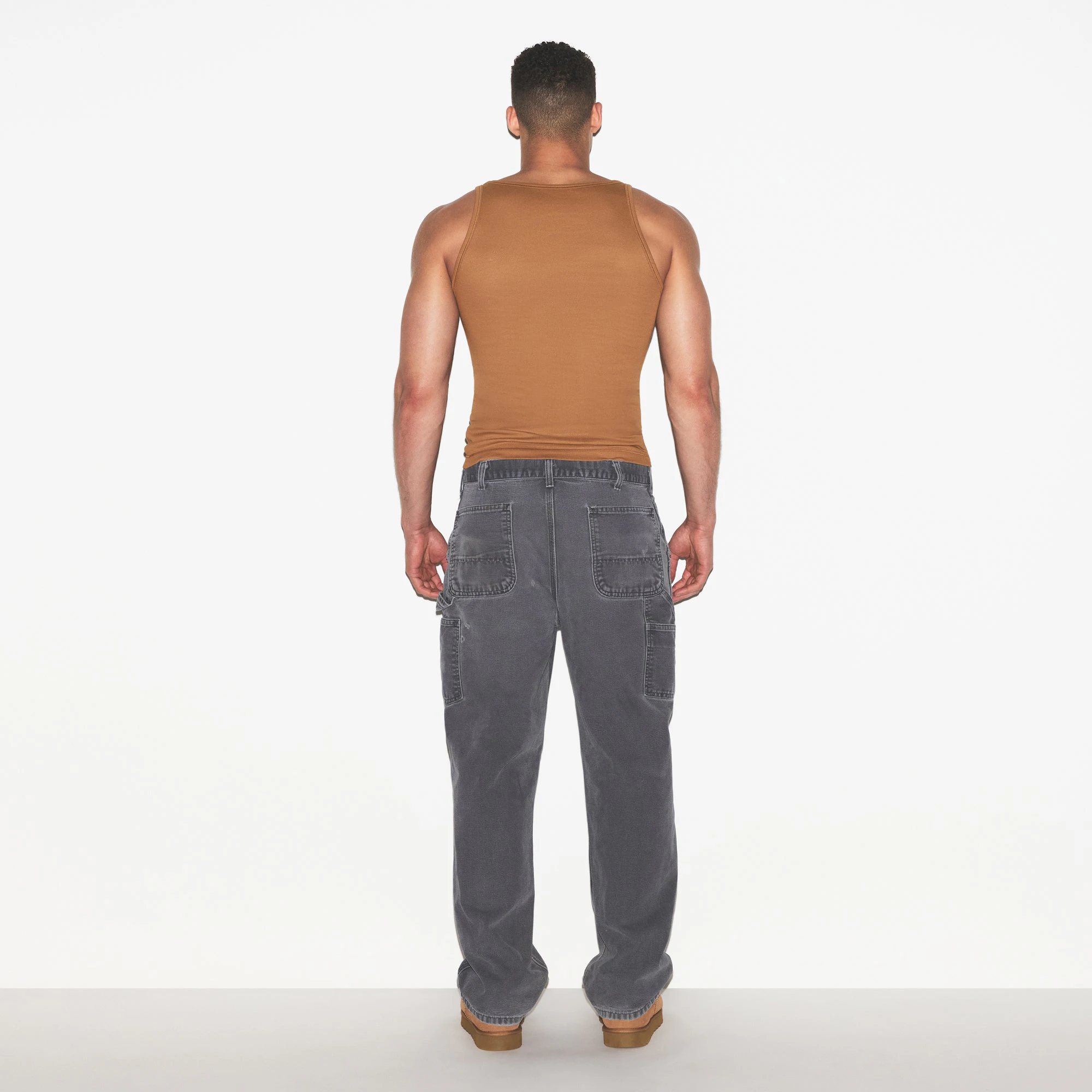 SKIMS COTTON MENS RIB TANK 3-PACK | ECRU RUSSET MULTI ON A MODEL FRONT VIEW | FOCUS: 0.0, 1.0, 0.9