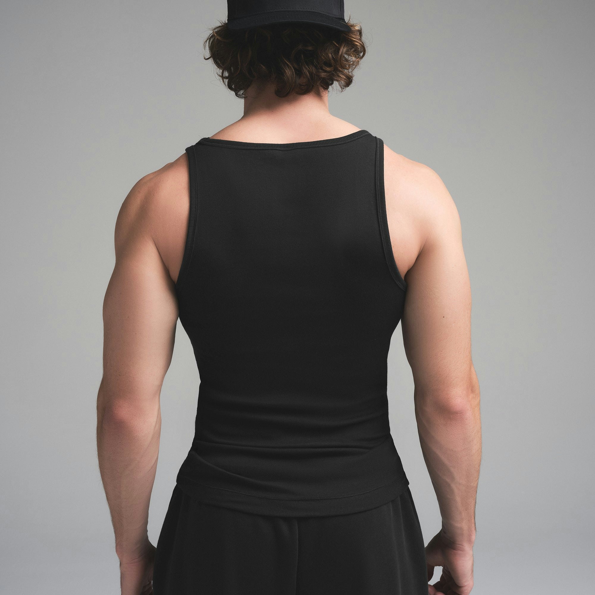 SKIMS COTTON MENS RIB TANK 3-PACK | HEATHER MULTI ON A MODEL SIDE VIEW | FOCUS: 0.0, 1.0, 0.9