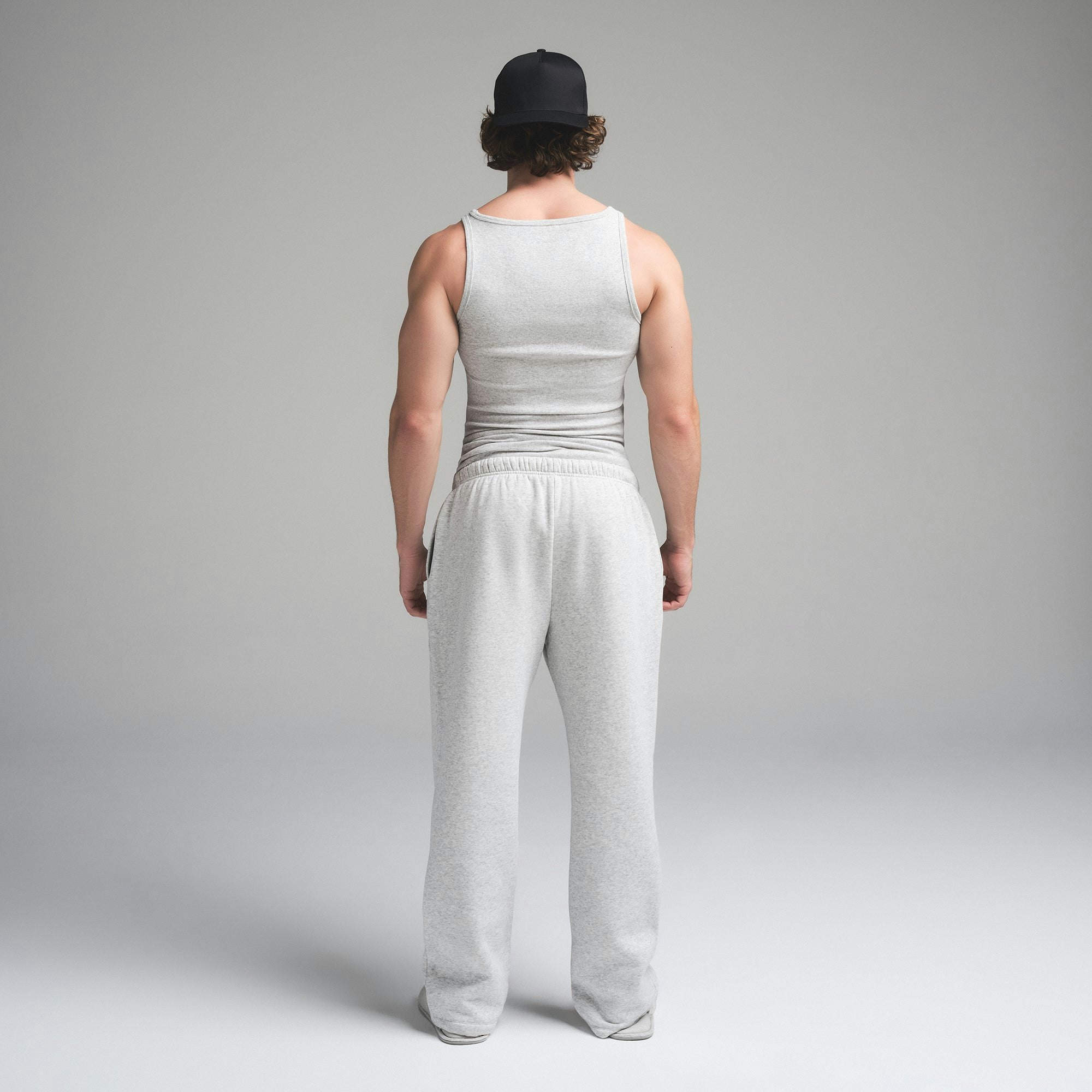 SKIMS COTTON MENS RIB TANK 3-PACK | HEATHER MULTI ON A MODEL SIDE VIEW | FOCUS: 0.0, 1.0, 0.9