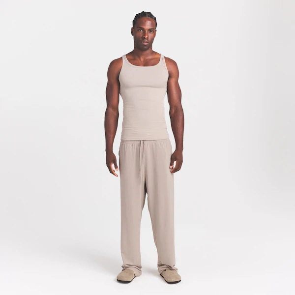 SKIMS COTTON RIB MENS TANK 3-PACK | LINEN ECRU MULTI ON A MODEL FRONT VIEW @ | FOCUS: 0.0, 1.0, 0.9